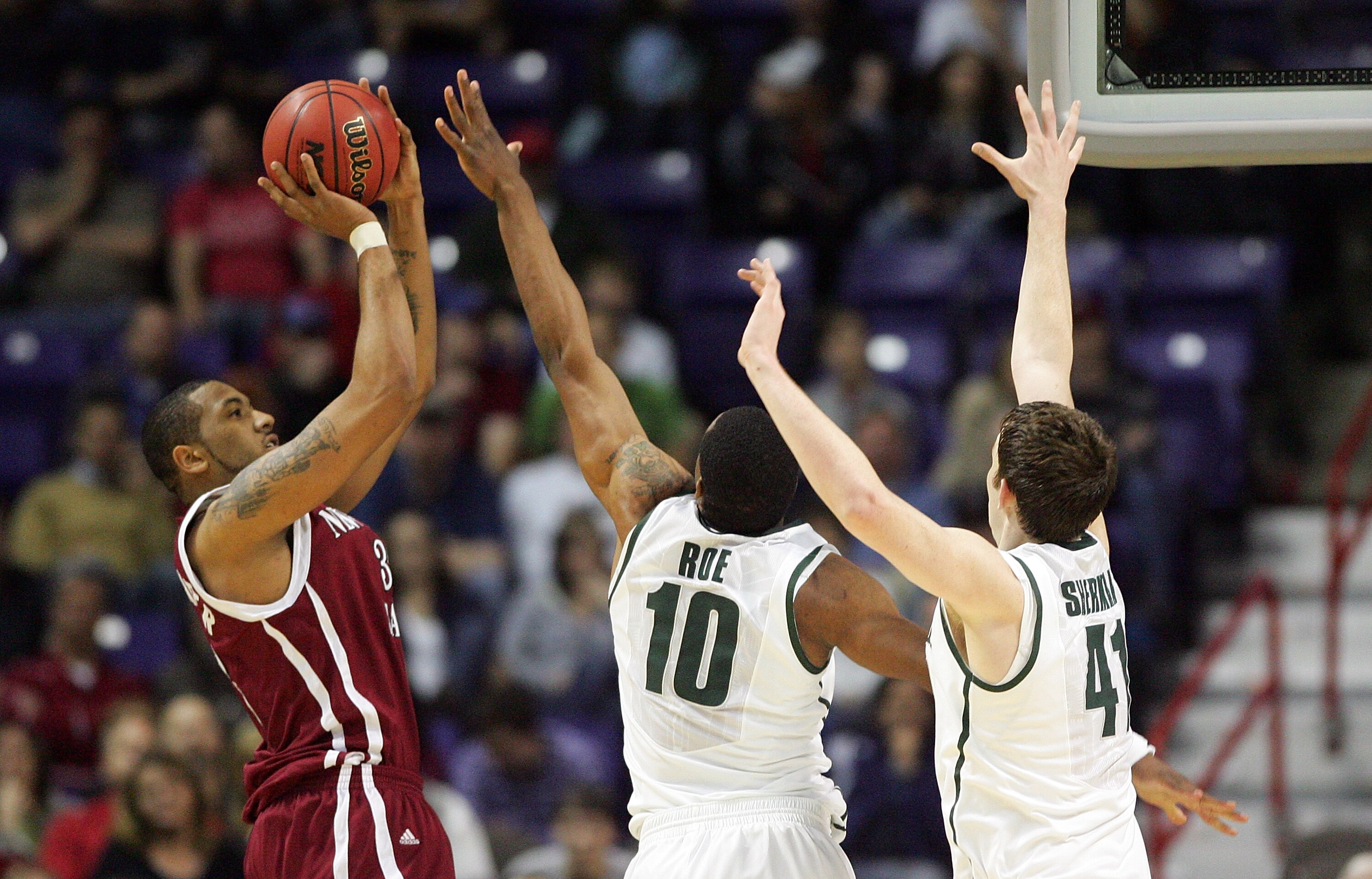 SPOKANE, WA - MARCH 19:  Troy Gillenwater #33 of the New Mexico St. Aggies is defended by Delvon Roe #10 and Garrick Sherman #41 of the Michigan St. Spartans during the first round of the 2010 NCAA menÕs basketball tournament at Spokane Arena on March 19,
