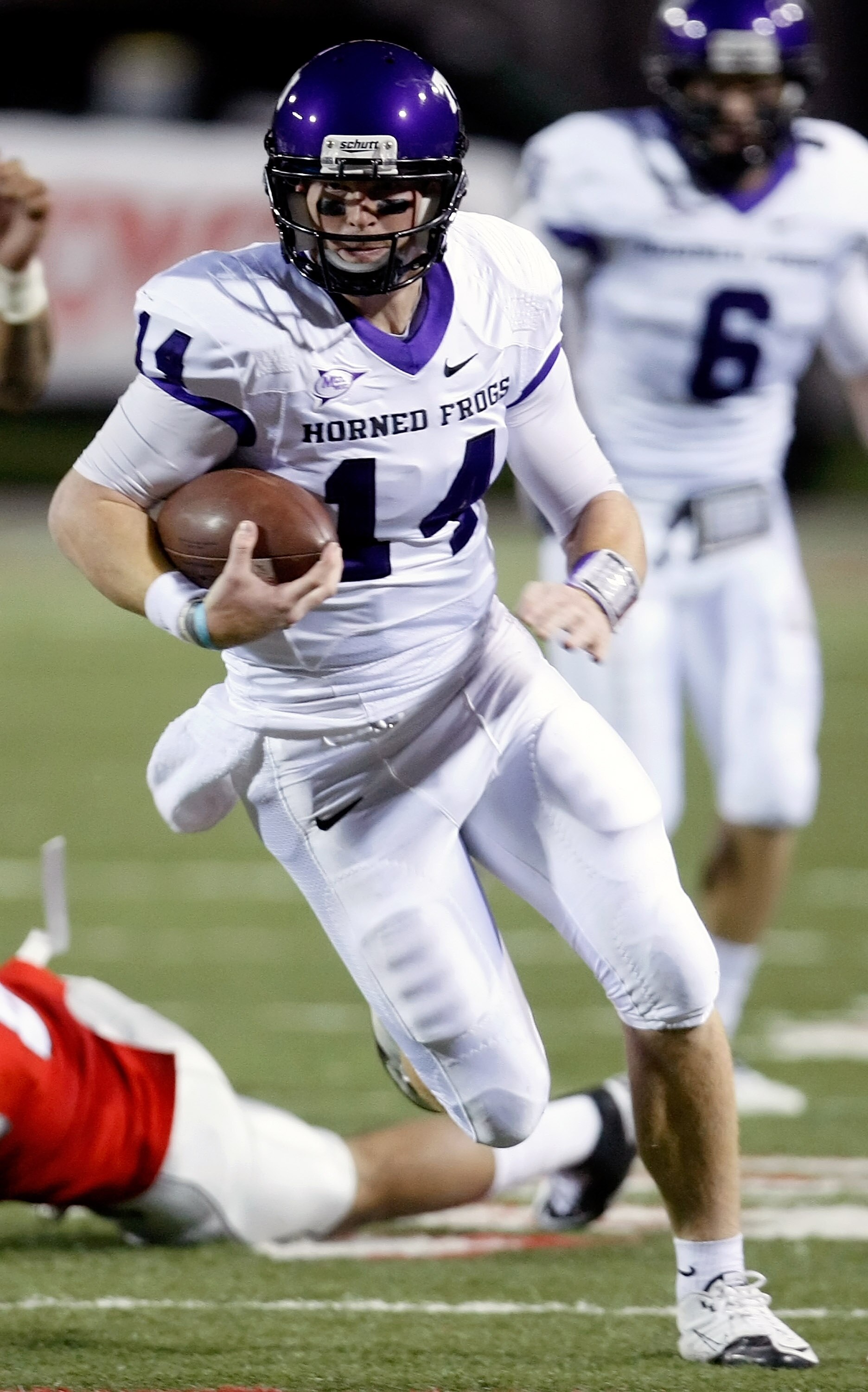 LAS VEGAS - OCTOBER 30: Quarterback Andy Dalton #14 of the Texas Christian University Horned Frogs runs for yardage against the UNLV Rebels at Sam Boyd Stadium October 30, 2010 in Las Vegas, Nevada. TCU won 48-6. (Photo by Ethan Miller/Getty Images) LAS VEGAS - OCTOBER 30: Quarterback Andy Dalton #14 of the Texas Christian University Horned Frogs runs for yardage against the UNLV Rebels at Sam Boyd Stadium October 30, 2010 in Las Vegas, Nevada. TCU won 48-6. (Photo by Ethan Miller/Getty Images)