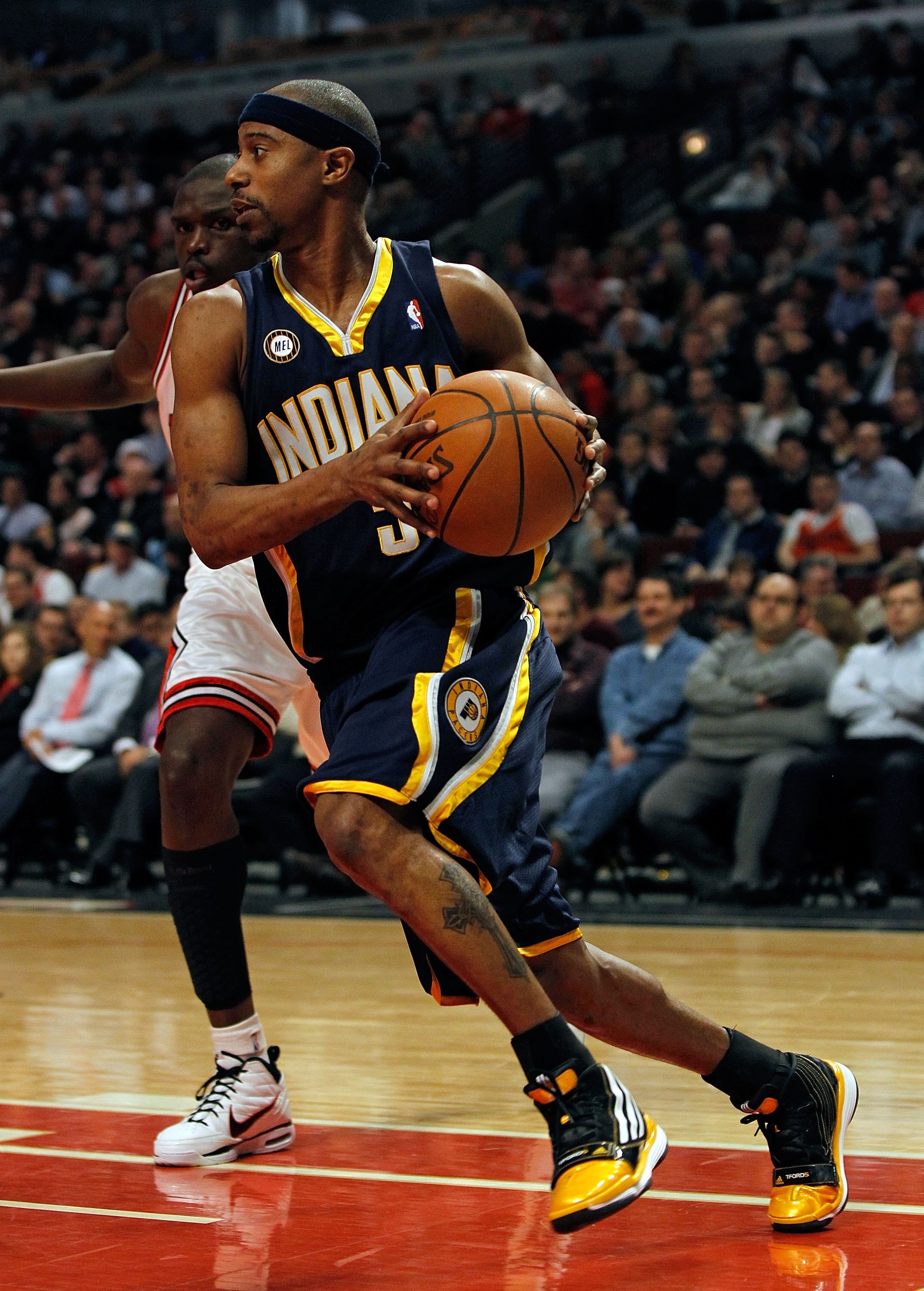 CHICAGO - FEBRUARY 24: T.J. Ford #5 of the Indiana Pacers moves past Loul Deng #9 of the Chicago Bulls at the United Center on February 24, 2010 in Chicago, Illinois. The Bulls defeated the Pacers 120-110. NOTE TO USER: User expressly acknowledges and agr
