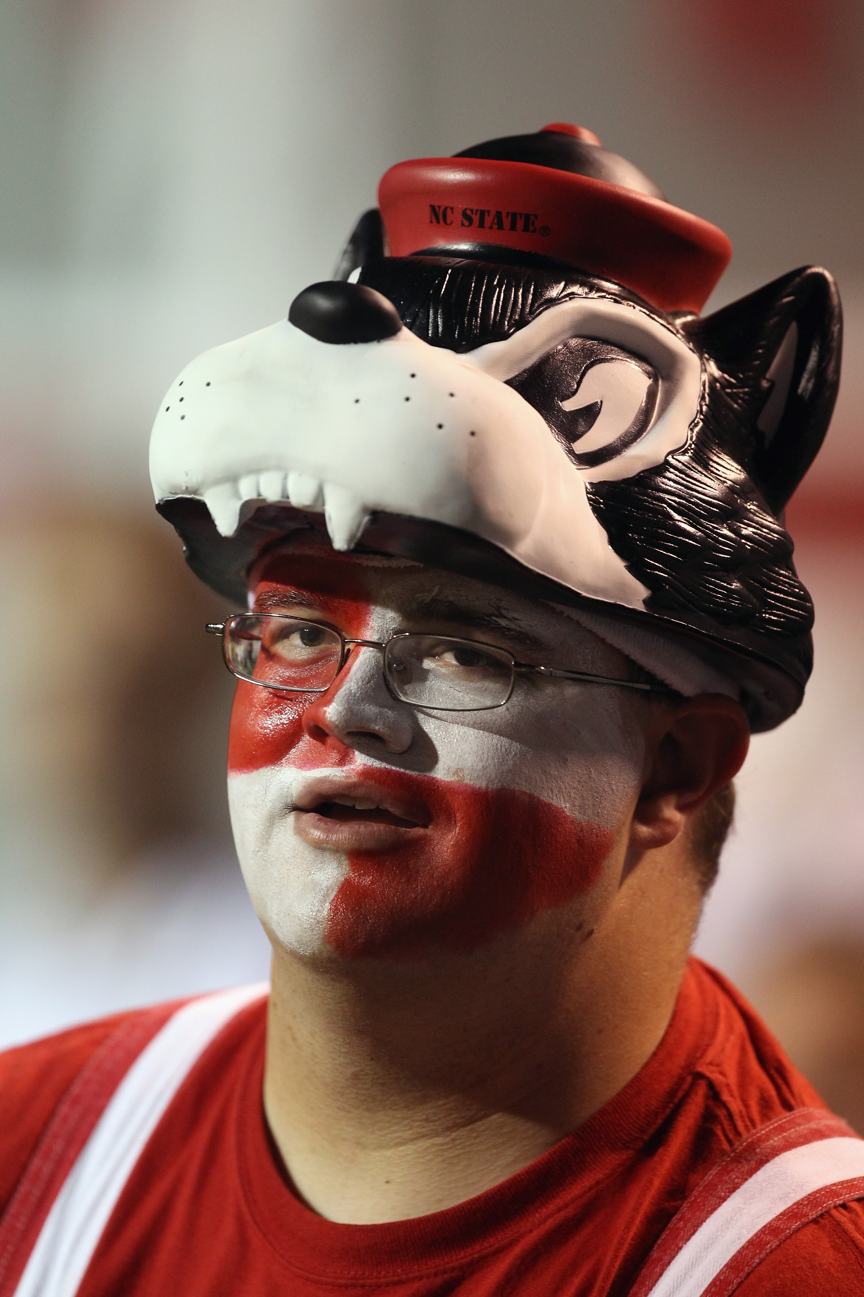 RALEIGH, NC - OCTOBER 28:  A fan of the North Carolina State Wolfpack watches on against the Florida State Seminoles during their game at Carter-Finley Stadium on October 28, 2010 in Raleigh, North Carolina.  (Photo by Streeter Lecka/Getty Images)