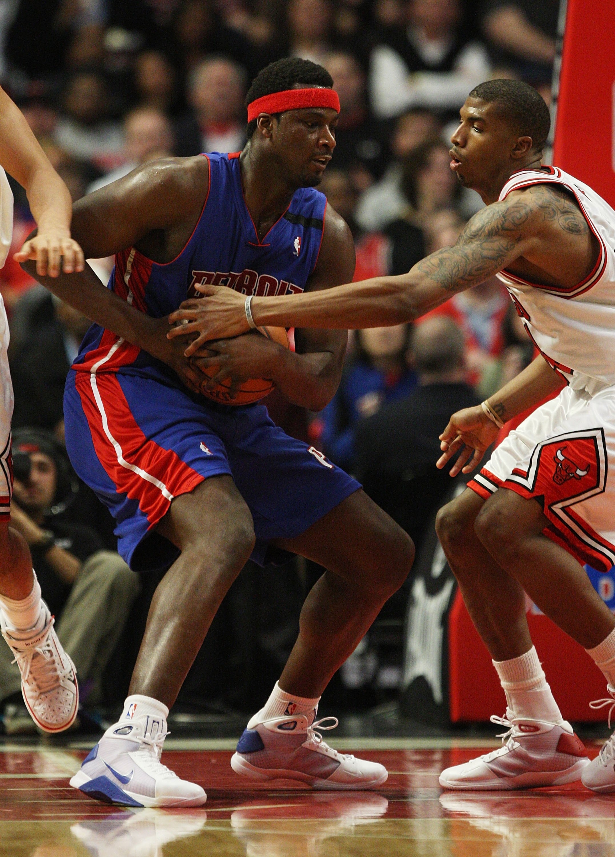 CHICAGO - MARCH 24: Tyrus Thomas #24 of the Chicago Bulls tries to steal the ball away from Kwame Brown #38 of the Detroit Pistons on March 24, 2009 at the United Center in Chicago, Illinois. The Bulls defeated the Pistons 99-91. NOTE TO USER: User expres
