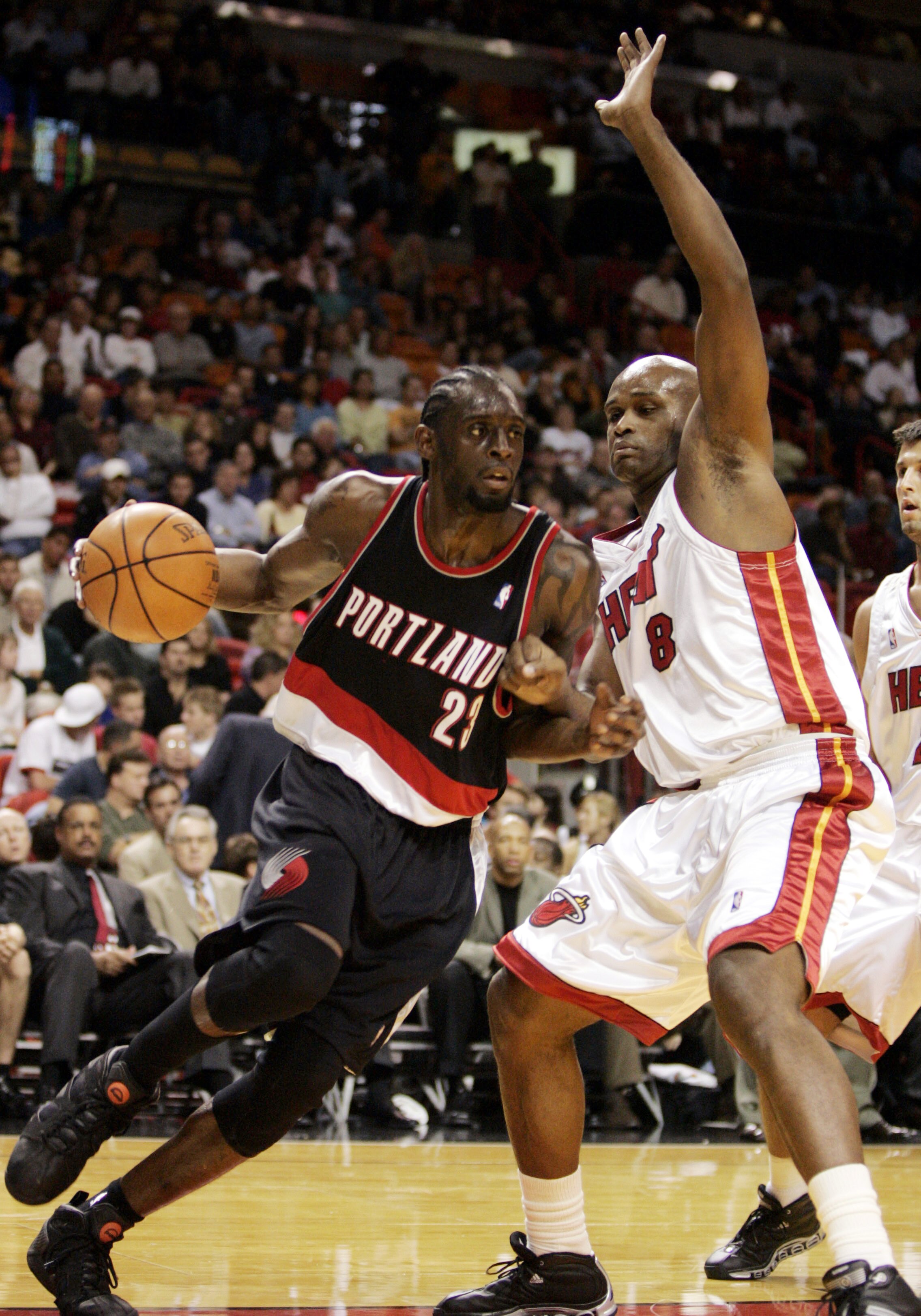 MIAMI - NOVEMBER 18:  Forward Darius Miles #23 of the Portland Trailblazers drives against forward Antoine Walker #8 of the Miami Heat on November 23, 2005 at the American Airlines Arena in Miami, Florida. NOTE TO USER: User expressly acknowledges and agr