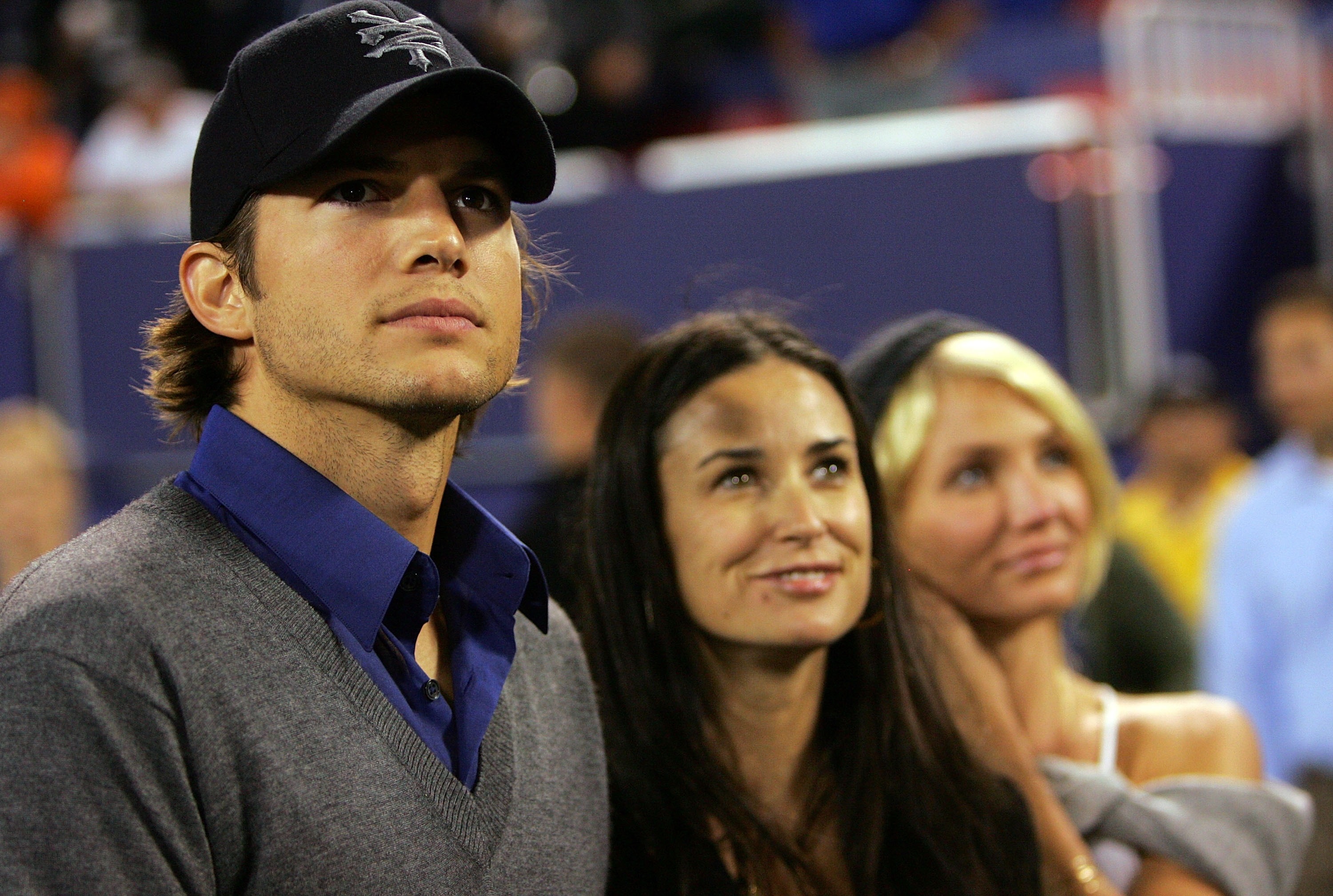 EAST RUTHERFORD, NJ - SEPTEMBER 30:  (L-R) Actor Ashton Kutcher, wife actress Demi Moore and actress Cameron Diaz stand on the sidelines before the start of the game between the Philadelphia Eagles and the New York Giants at Giants Stadium on September 30