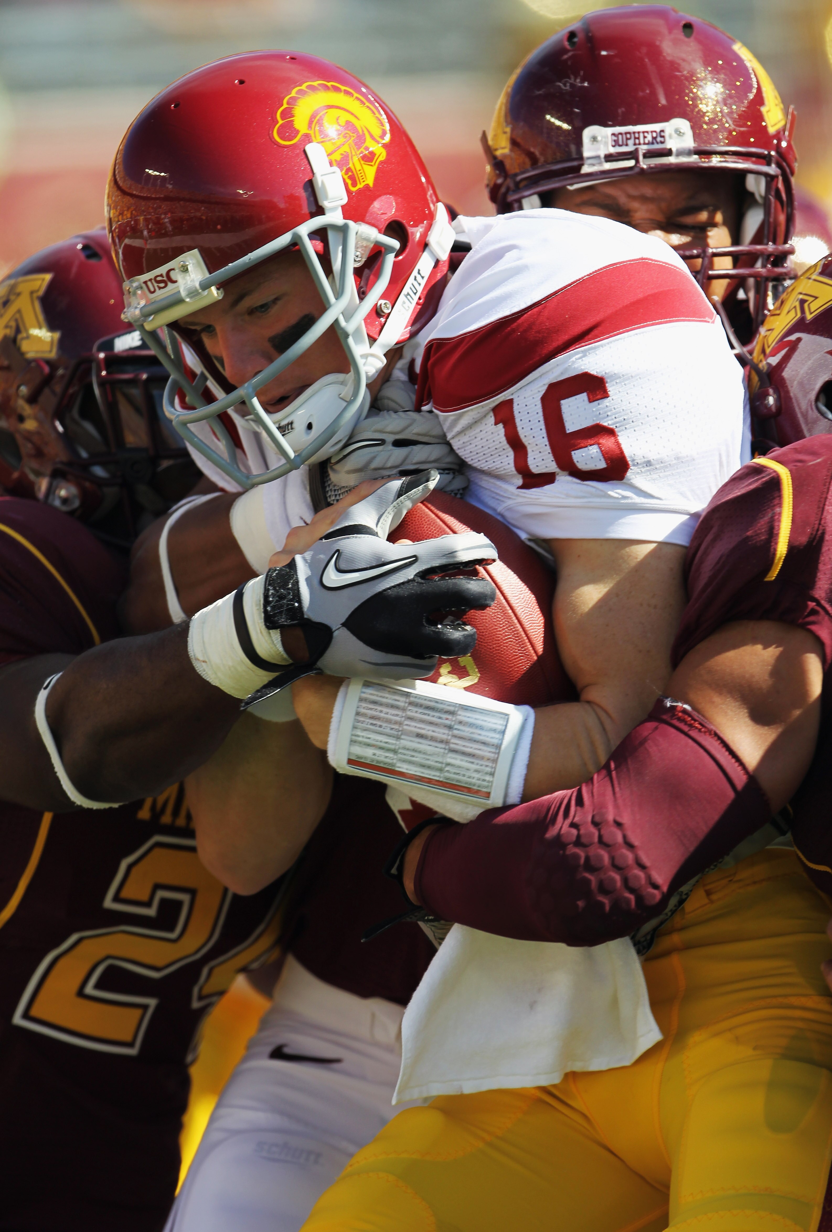 MINNEAPOLIS - SEPTEMBER 18:  Mitch Mustain #16 of the USC Trojans is stopped short of scoring a two point conversion by the Minnesota Golden Gophers defense during the game on September 18, 2010 at TCF Bank Stadium in Minneapolis, Minnesota.  (Photo by Ja