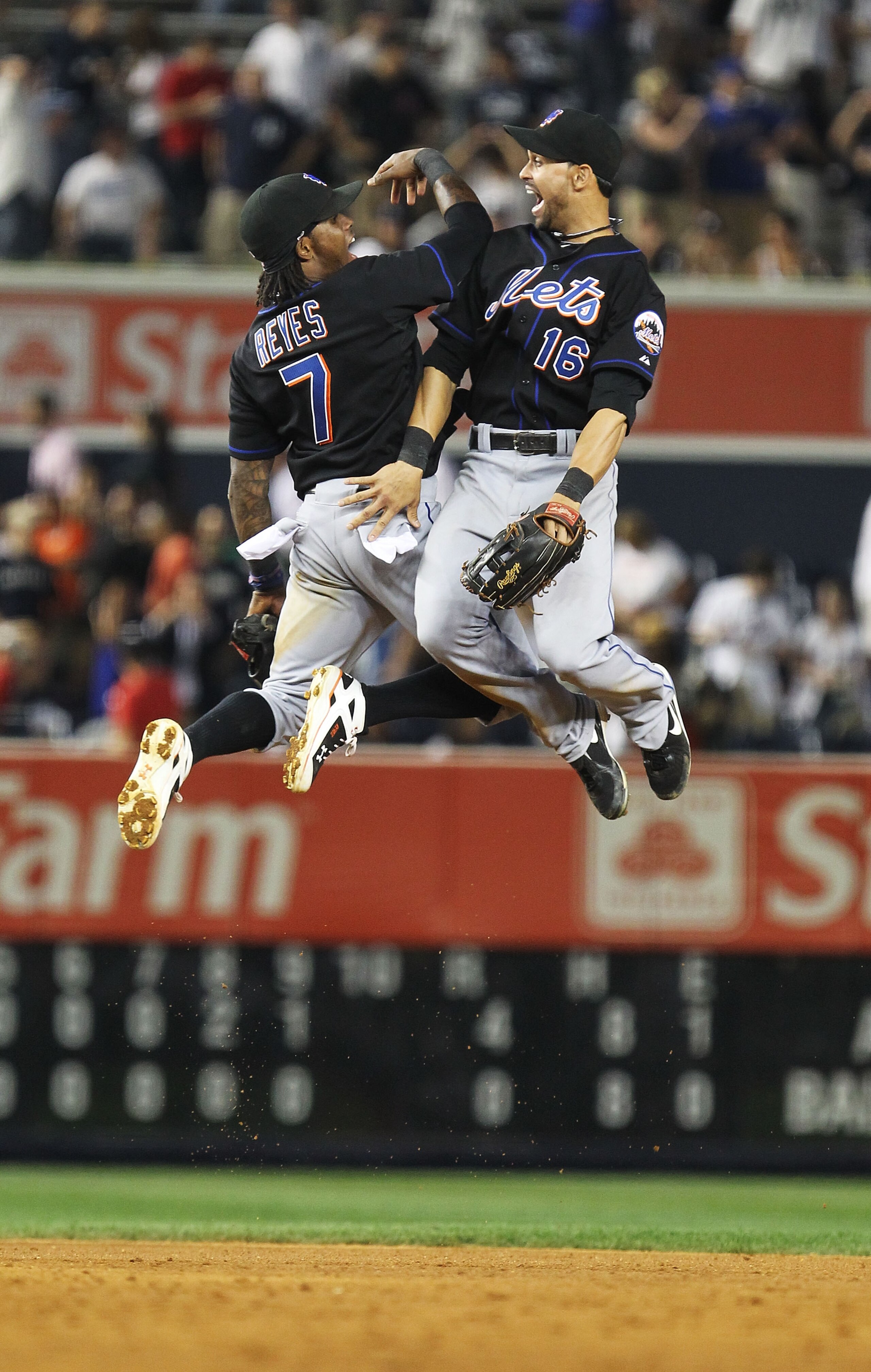 NEW YORK - JUNE 18:  Jose Reyes #7 and Angel Pagan #16 of the New York Mets celebrate a 4-0 win against the New York Yankees on June 18, 2010 at Yankee Stadium in the Bronx borough of New York City.  (Photo by Al Bello/Getty Images)