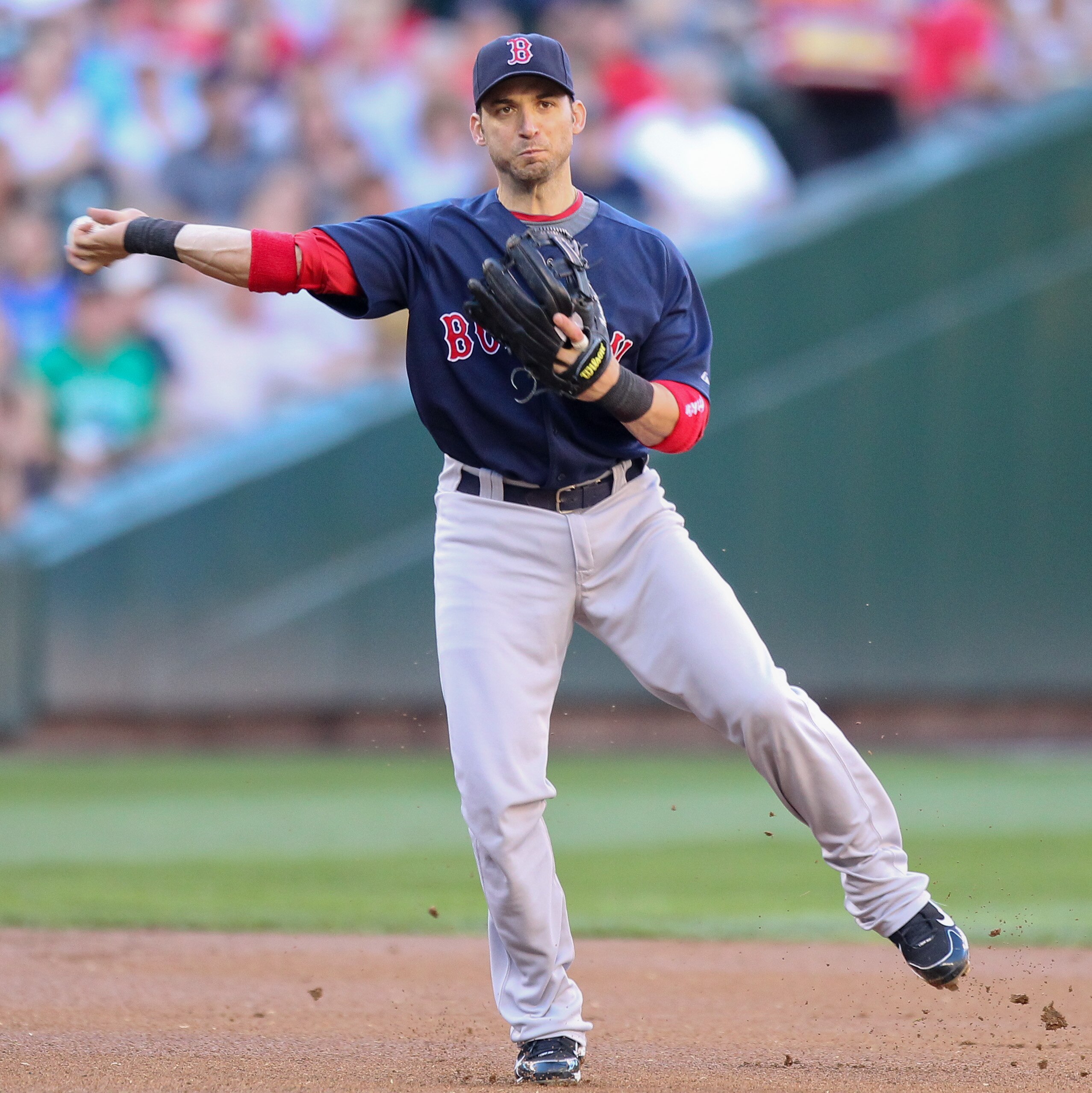 SEATTLE - JULY 24:  Shortstop Marco Scutaro #16 of the Boston Red Sox throws to first against the Seattle Mariners at Safeco Field on July 24, 2010 in Seattle, Washington. (Photo by Otto Greule Jr/Getty Images)