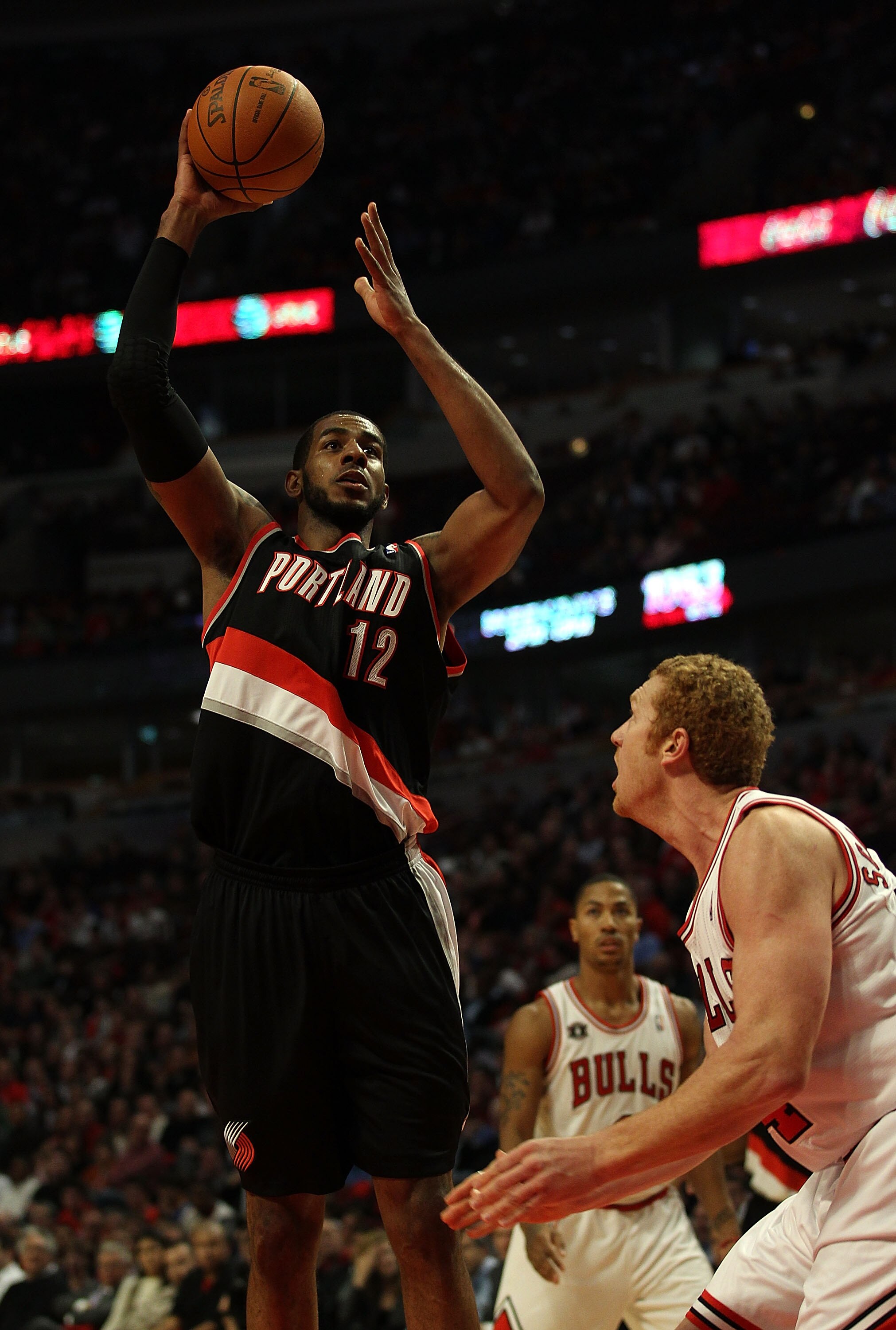 CHICAGO - NOVEMBER 01: LaMarcus Aldridge #12 of the Portland Trail Blazers puts up a shot over Brian Scalabrine #24 of the Chicago Bulls at the United Center on November 1, 2010 in Chicago, Illinois. The Bulls defeated the Trail Blazers 110-98. NOTE TO US