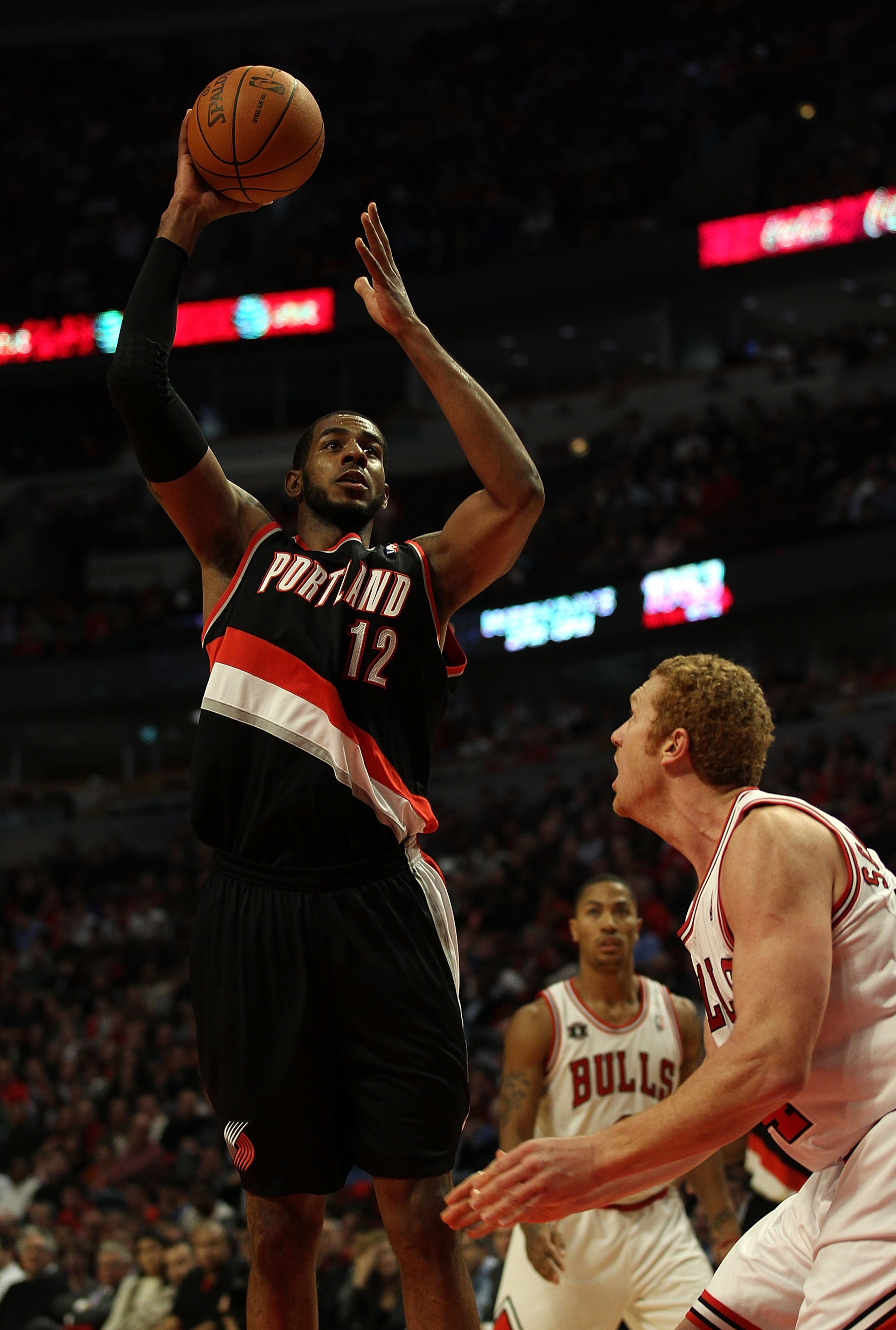 CHICAGO - NOVEMBER 01: LaMarcus Aldridge #12 of the Portland Trail Blazers puts up a shot over Brian Scalabrine #24 of the Chicago Bulls at the United Center on November 1, 2010 in Chicago, Illinois. The Bulls defeated the Trail Blazers 110-98. NOTE TO US
