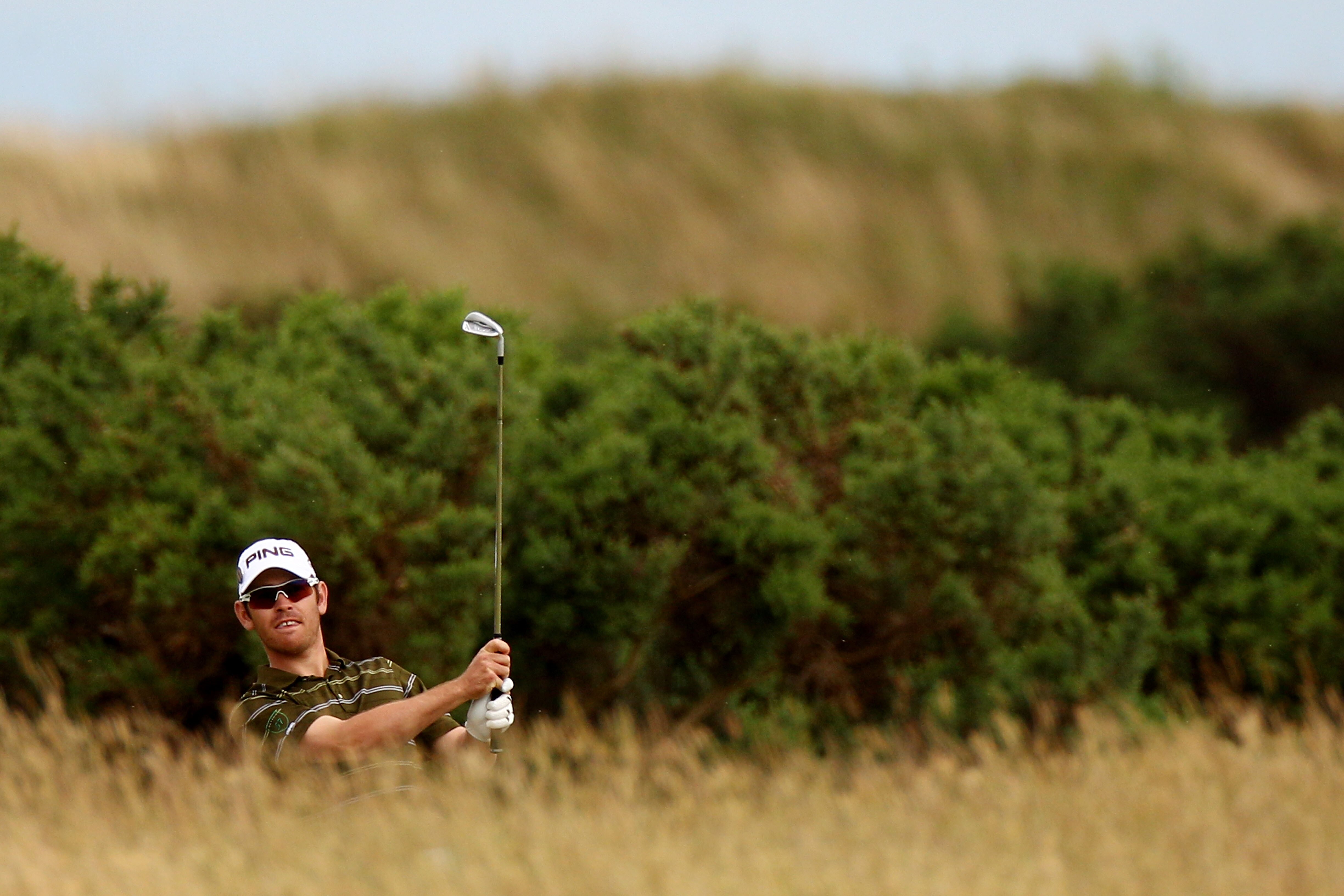 ST ANDREWS, SCOTLAND - JULY 18:  Louis Oosthuizen of South Africa watches a shot on the tenth hole during the final round of the 139th Open Championship on the Old Course, St Andrews on July 18, 2010 in St Andrews, Scotland.  (Photo by Richard Heathcote/G