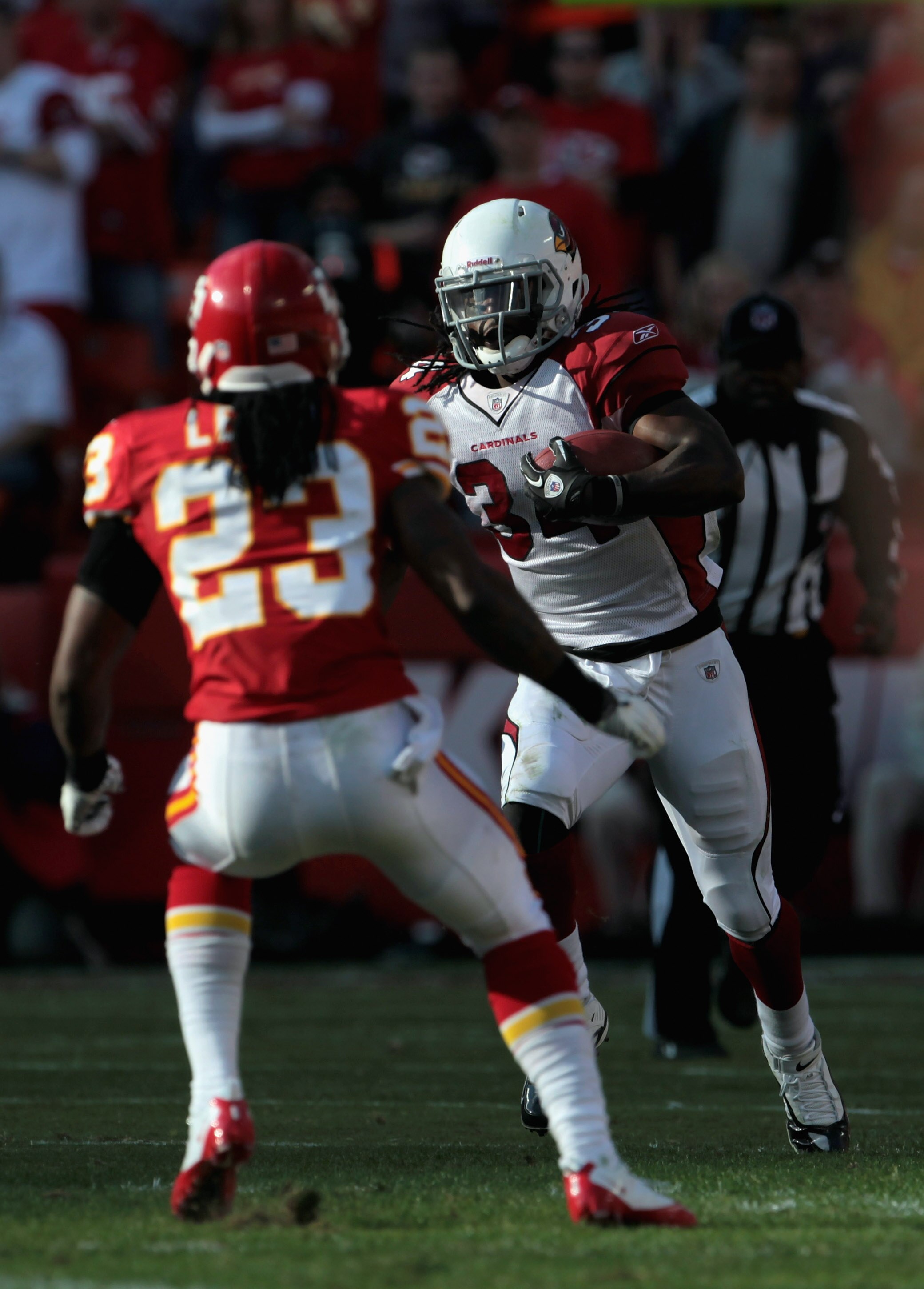 KANSAS CITY, MO - NOVEMBER 21:  Tim Hightower #34 of the Arizona Cardinals carries the ball as Kendrick Lewis #23 of the Kansas City Chiefs defends during the game on November 21, 2010 at Arrowhead Stadium in Kansas City, Missouri.  (Photo by Jamie Squire