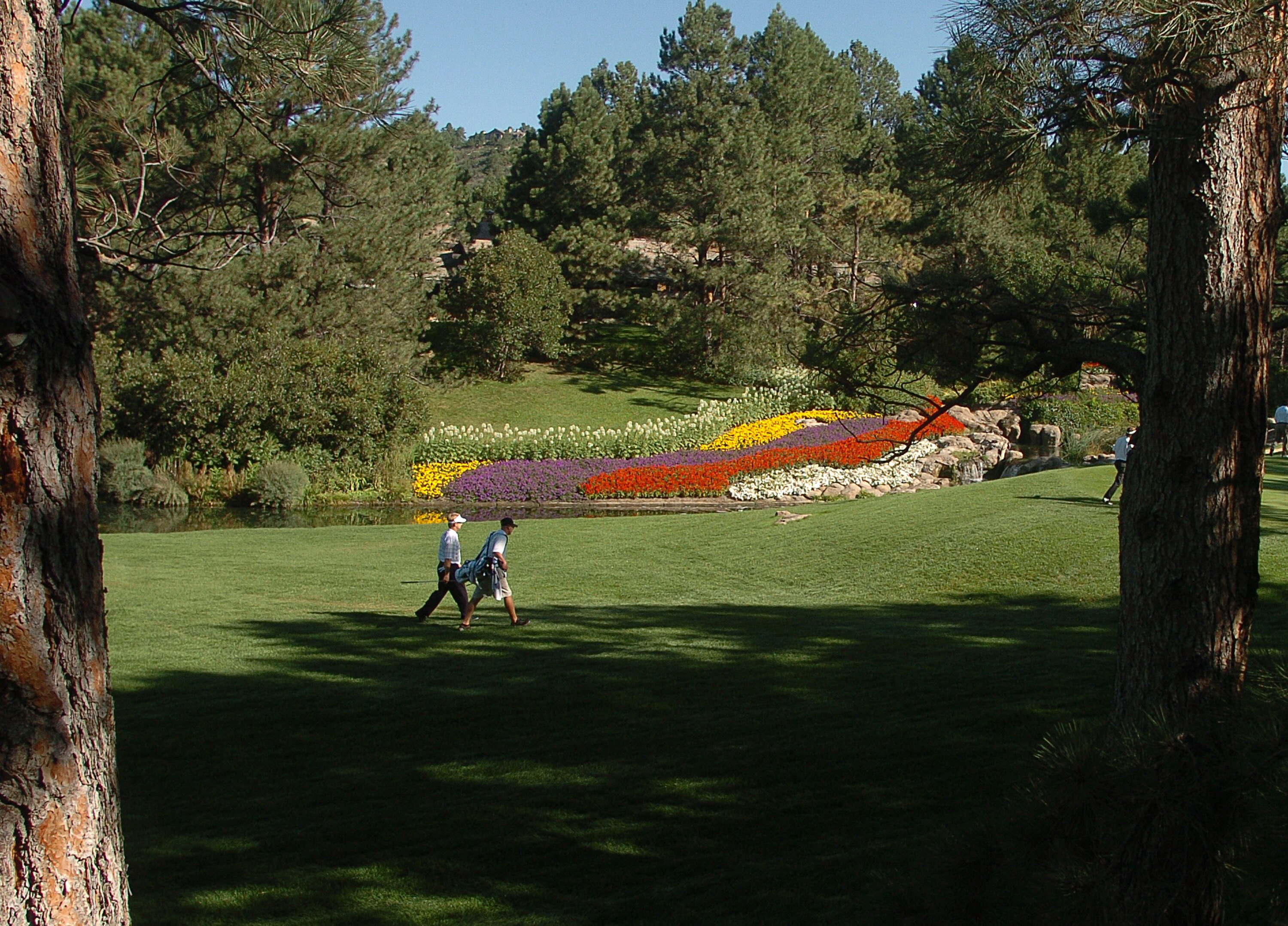 UNITED STATES - AUGUST 07:  Players make their way to the scenic fourth green during the final round of The 2005 INTERNATIONAL at Castle Pines Country Club in Castle Rock, Colorado August 7, 2005.  (Photo by Steve Grayson/Getty Images)