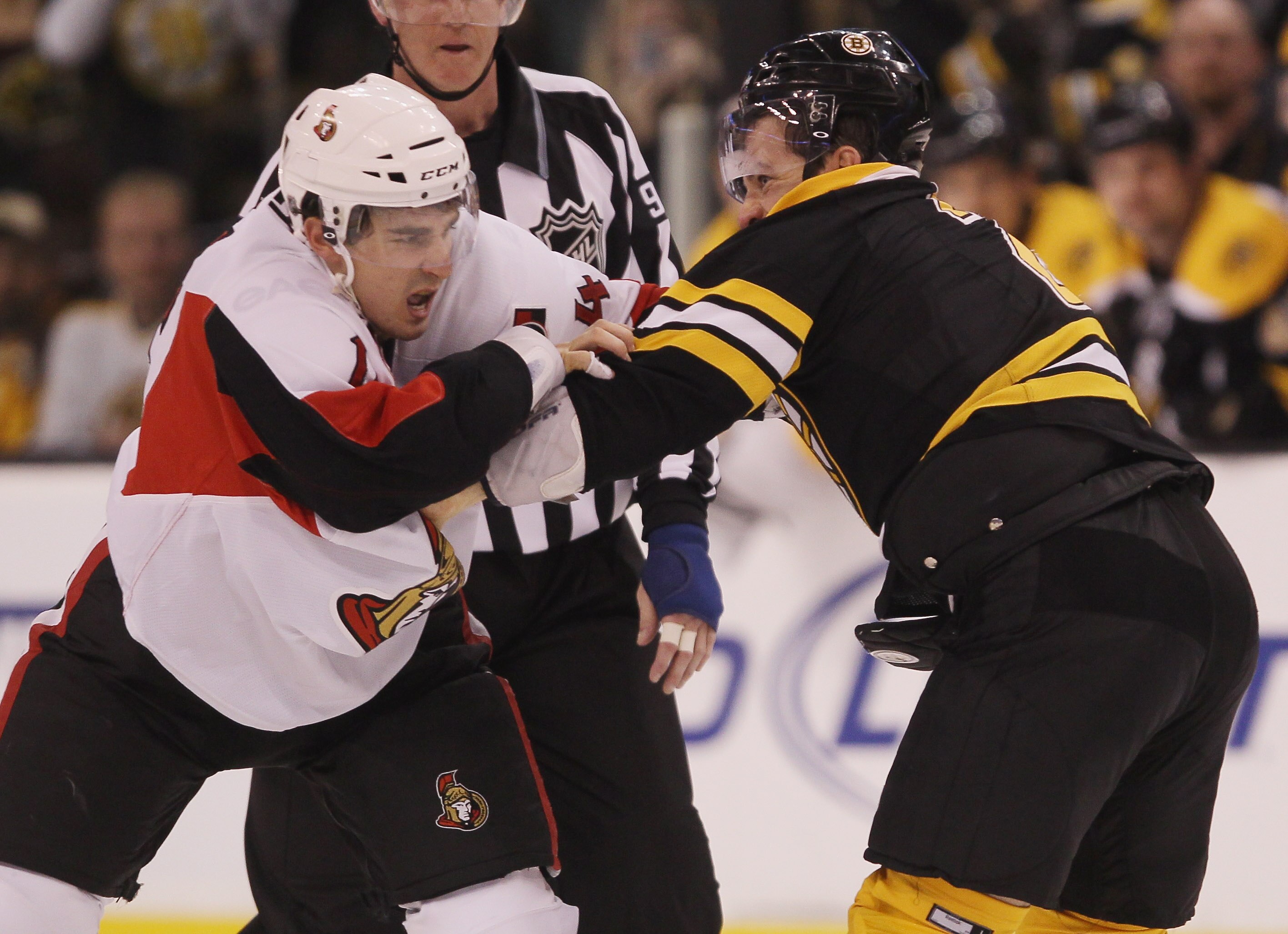 BOSTON - NOVEMBER 13:  Mark Recchi #28 of the Boston Bruins reaches his 1,000th career penalty minute with this fight with Chris Campoli #14 of the Ottawa Senators on November 13, 2010 at the TD Garden in Boston, Massachusetts. The Ottawa Senators defeate