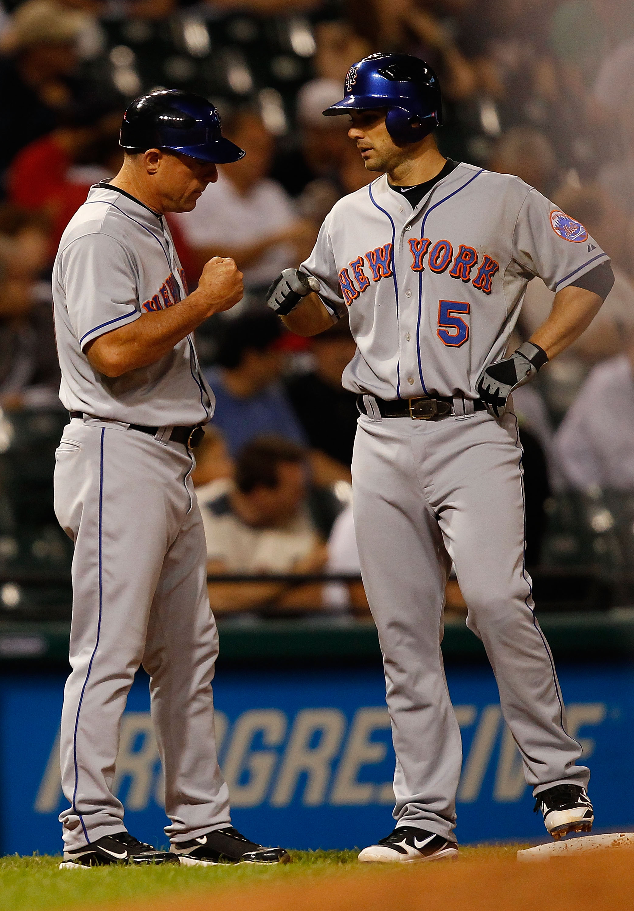 CLEVELAND - JUNE 17:  David Wright #5 of the New York Mets is congratulated at third base by Chip Hale #51 during the game against the Cleveland Indians on June 17, 2010 at Progressive Field in Cleveland, Ohio.  (Photo by Jared Wickerham/Getty Images)
