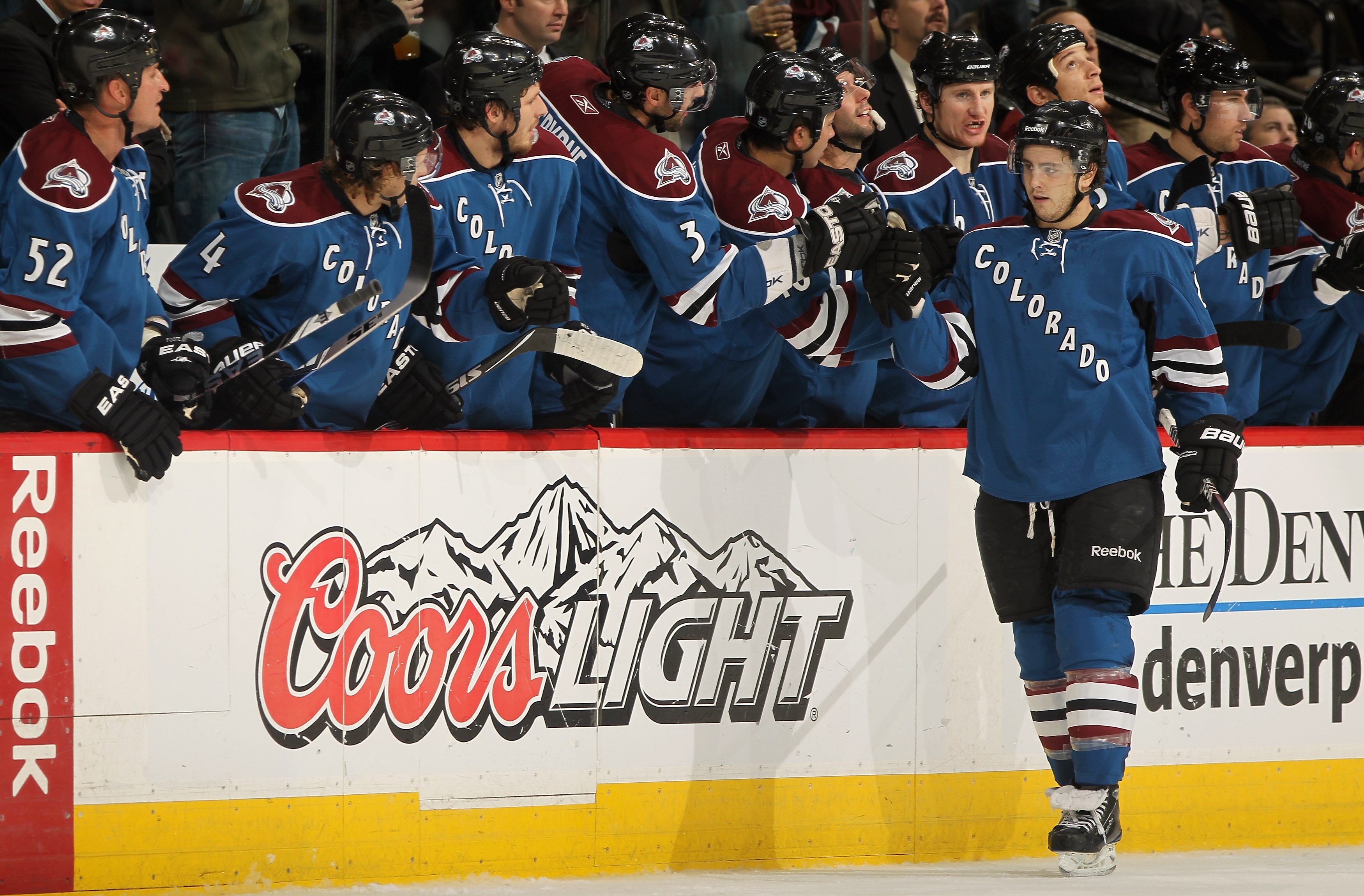 DENVER - NOVEMBER 19:  Kevin Shattenkirk #8 of the Colorado Avalanche is congratulated by his teammates for his second period goal against the New York Rangers at the Pepsi Center on November 19, 2010 in Denver, Colorado.  (Photo by Doug Pensinger/Getty I