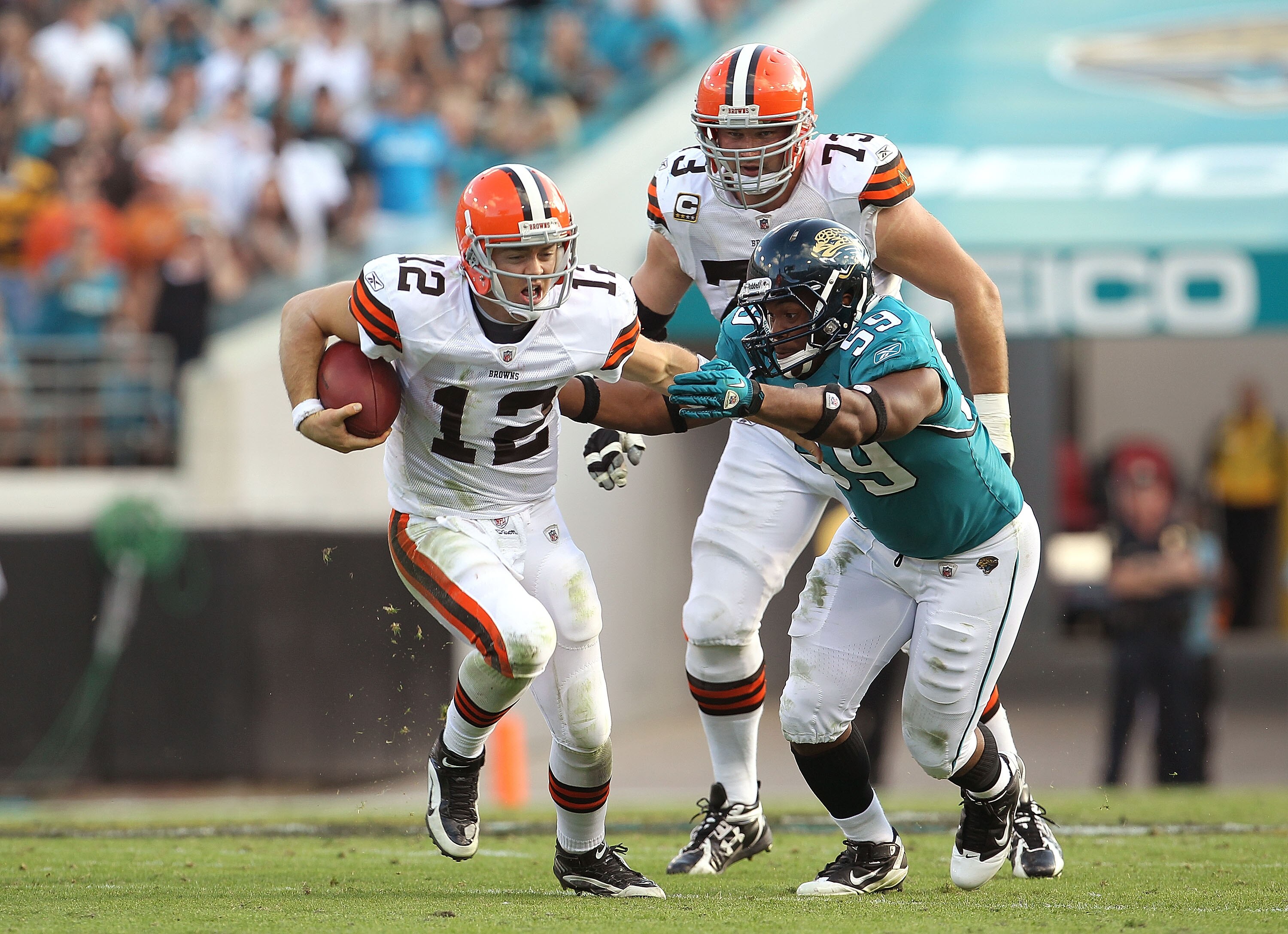 JACKSONVILLE, FL - NOVEMBER 21:  Colt McCoy #12  of the Cleveland Browns is chased down by Larry Hart #59  during a game agaisnt the Jacksonville Jaguars at EverBank Field on November 21, 2010 in Jacksonville, Florida.  (Photo by Mike Ehrmann/Getty Images