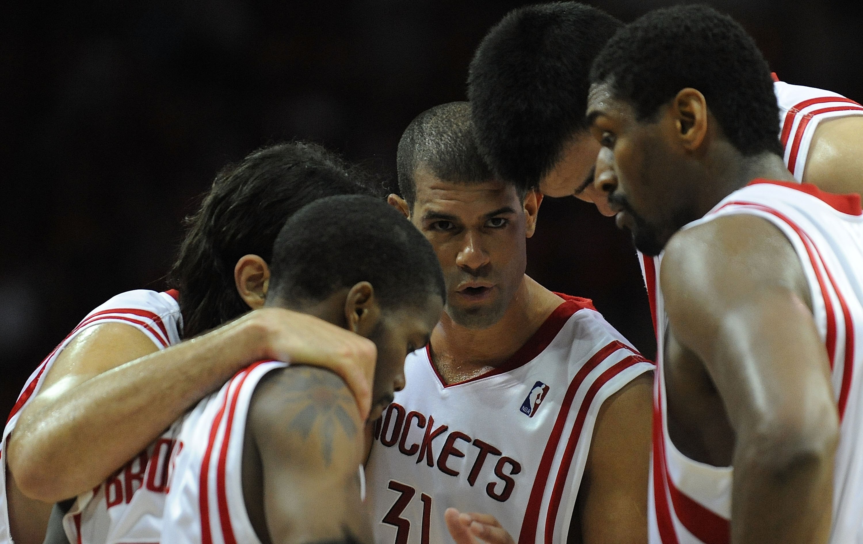 HOUSTON - APRIL 24:  Forward Shane Battier #31 huddles with Aaron Brooks #0, Luis Scola #4, Yao Ming #11 and Ron Artest #96 of the Houston Rockets in Game Three of the Western Conference Quarterfinals during the 2009 NBA Playoffs at Toyota Center on April