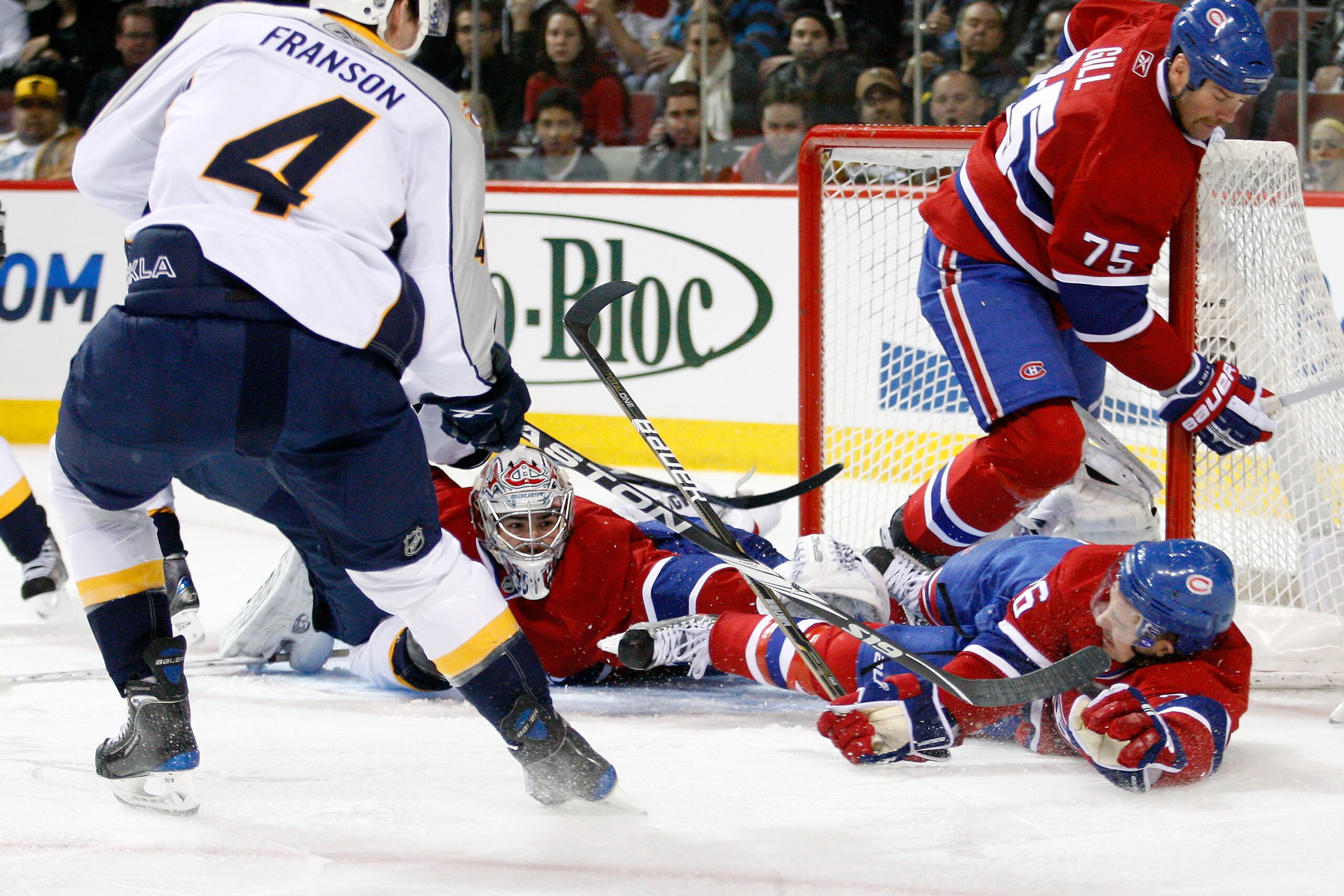 MONTREAL - NOVEMBER 18:  Josh Gorges #26 of the Montreal Canadiens lies down to block a shot by Cody Franson #4 of the Nashville Predators during the NHL game at the Bell Centre on November 18, 2010 in Montreal, Quebec, Canada.  The Predators defeated the