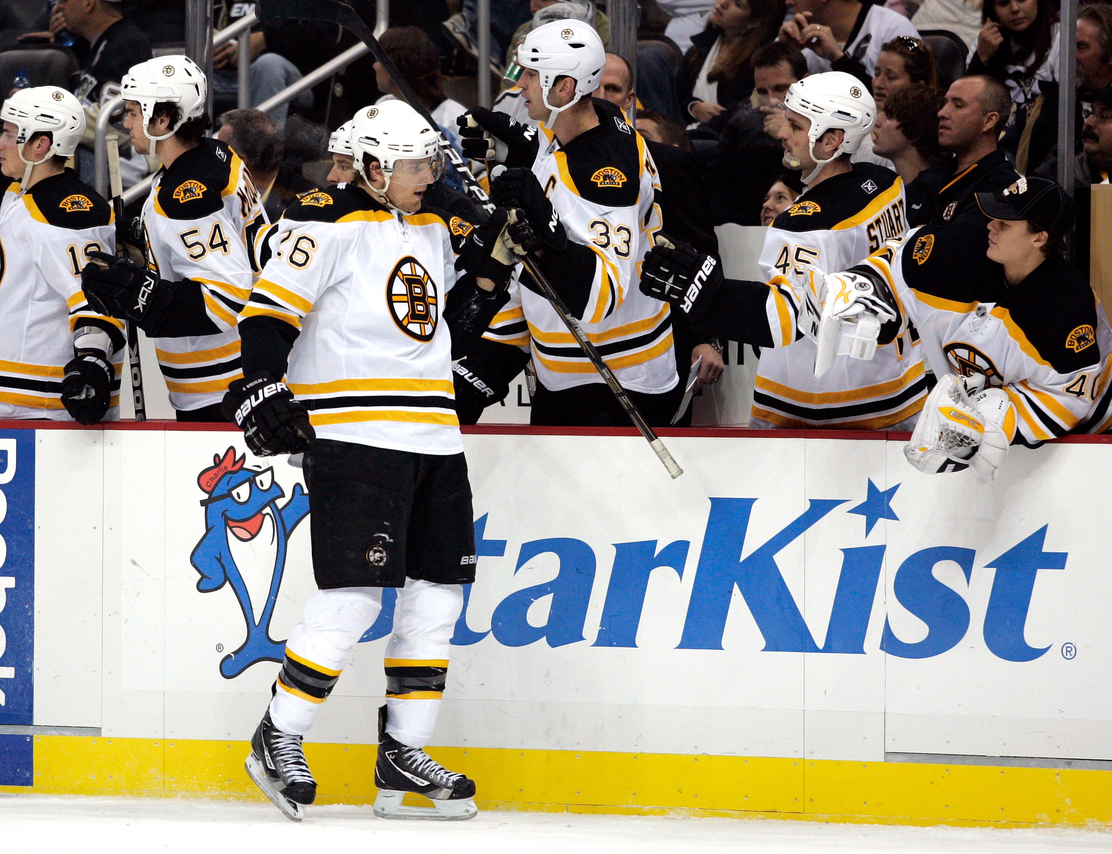PITTSBURGH - NOVEMBER 10: Blake Wheeler #26 of the Boston Bruins celebrates his third period goal with teammates against the Pittsburgh Penguins at Consol Energy Center on November 10, 2010 in Pittsburgh, Pennsylvania. The Bruins defeated the Penguins 7 PITTSBURGH - NOVEMBER 10: Blake Wheeler #26 of the Boston Bruins celebrates his third period goal with teammates against the Pittsburgh Penguins at Consol Energy Center on November 10, 2010 in Pittsburgh, Pennsylvania. The Bruins defeated the Penguins 7
