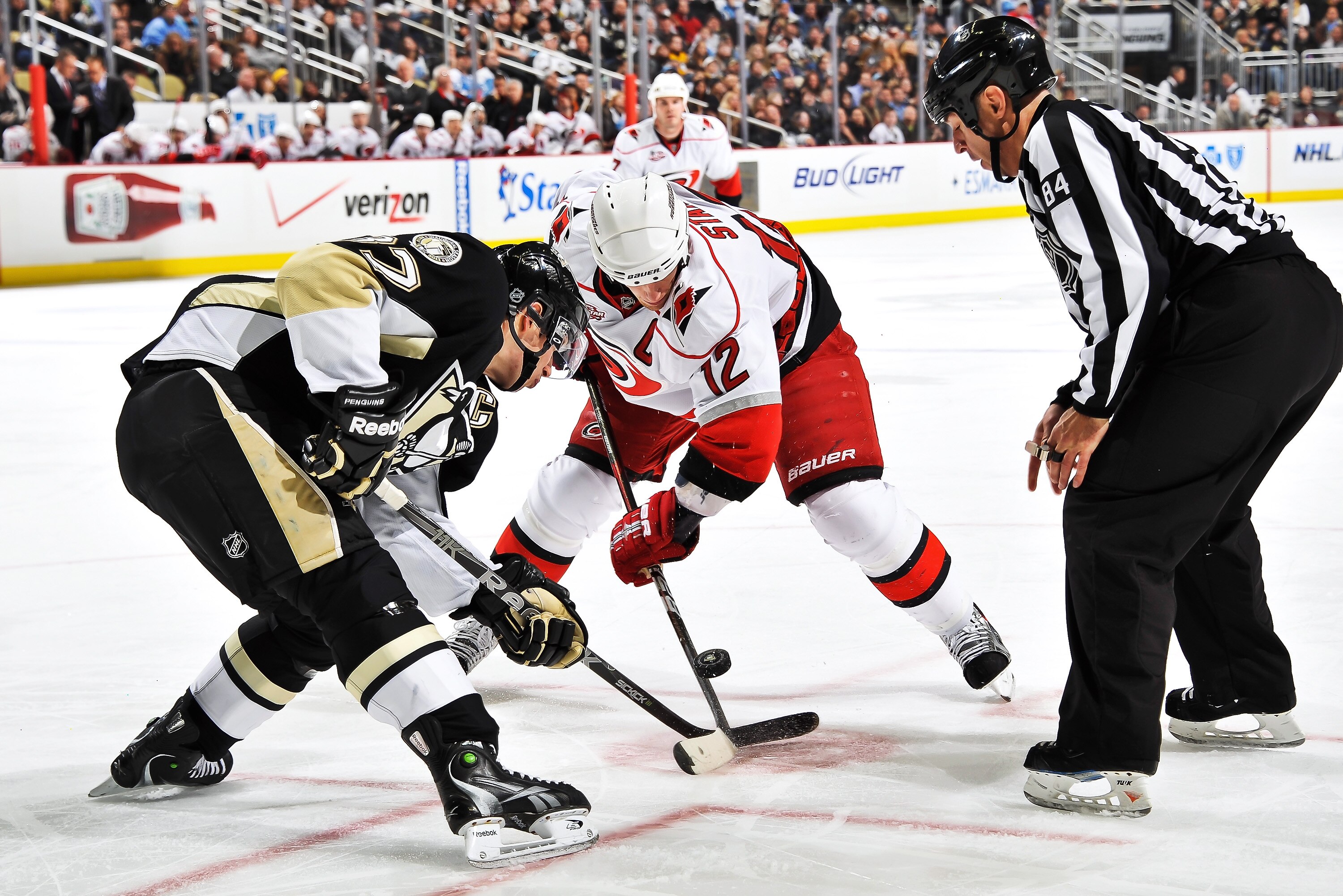 PITTSBURGH - NOVEMBER 19:  Sidney Crosby #87 of the Pittsburgh Penguins and Eric Staal #12 of the Carolina Hurricanes take a face off on November 19, 2010 at Consol Energy Center in Pittsburgh, Pennsylvania.  (Photo by Jamie Sabau/Getty Images)