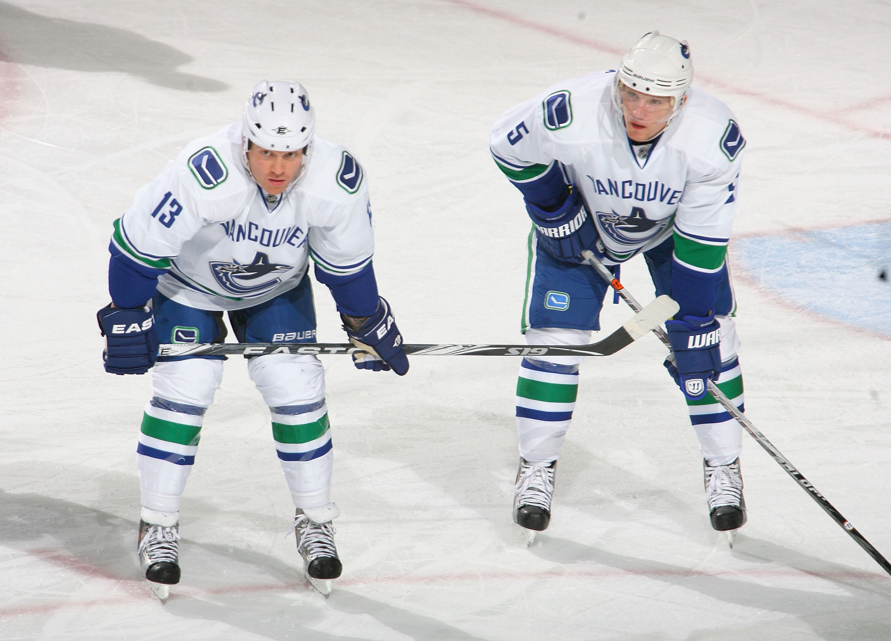 BUFFALO, NY - NOVEMBER 15: Raffi Torres #13 and Christian Ehrhoff #5 of the Vancouver Canucks wait for  a faceoff against the Buffalo Sabres  at HSBC Arena on November 15, 2010 in Buffalo, New York. Buffalo won 4-3 in overtime.  (Photo by Rick Stewart/Get