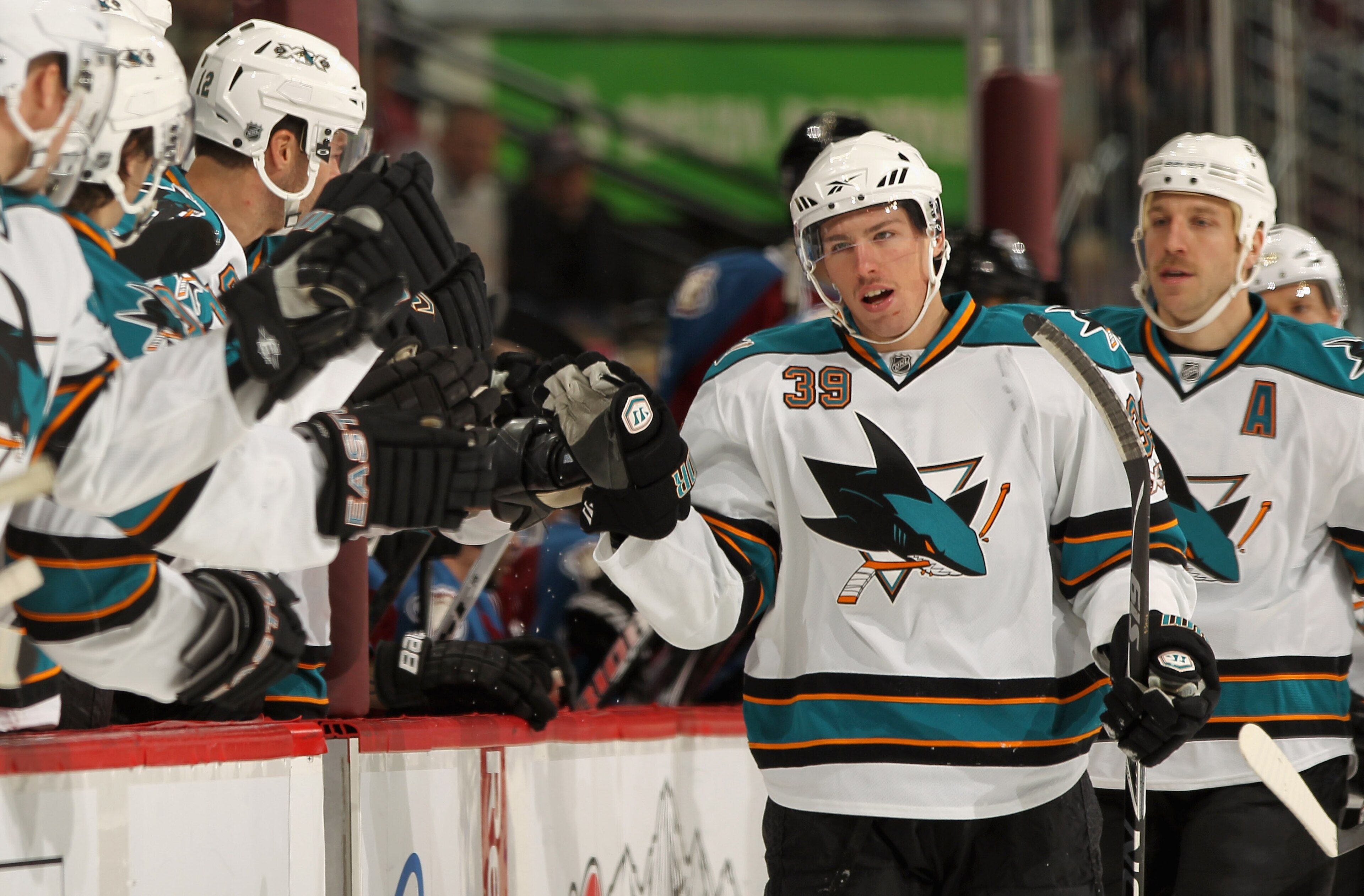DENVER - NOVEMBER 17: Logan Couture #39 of the San Jose Sharks heads to the bench to celebrate his goal along with Ryane Clowe #29 who earned an assist on the first period goal against the Colorado Avalanche at the Pepsi Center on November 17, 2010 in De DENVER - NOVEMBER 17: Logan Couture #39 of the San Jose Sharks heads to the bench to celebrate his goal along with Ryane Clowe #29 who earned an assist on the first period goal against the Colorado Avalanche at the Pepsi Center on November 17, 2010 in De