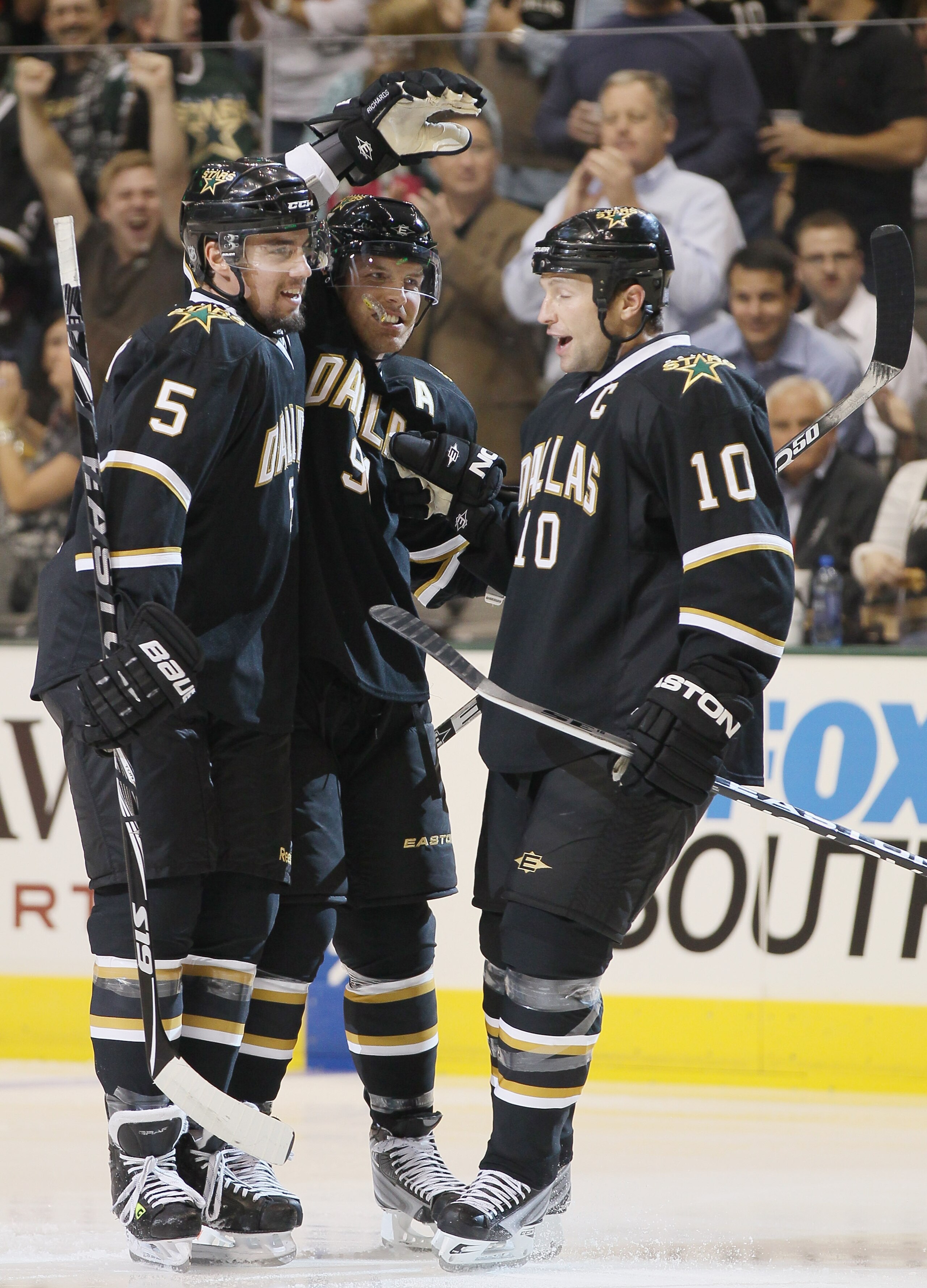 DALLAS - OCTOBER 14:  Brad Richards #91 of the Dallas Stars is congratulated by teammates Matt Niskanen #5 and Brenden Morrow #10 after Richards scored in the first period agianst the Detroit Red Wings on October 14, 2010 at the American Airlines Center i