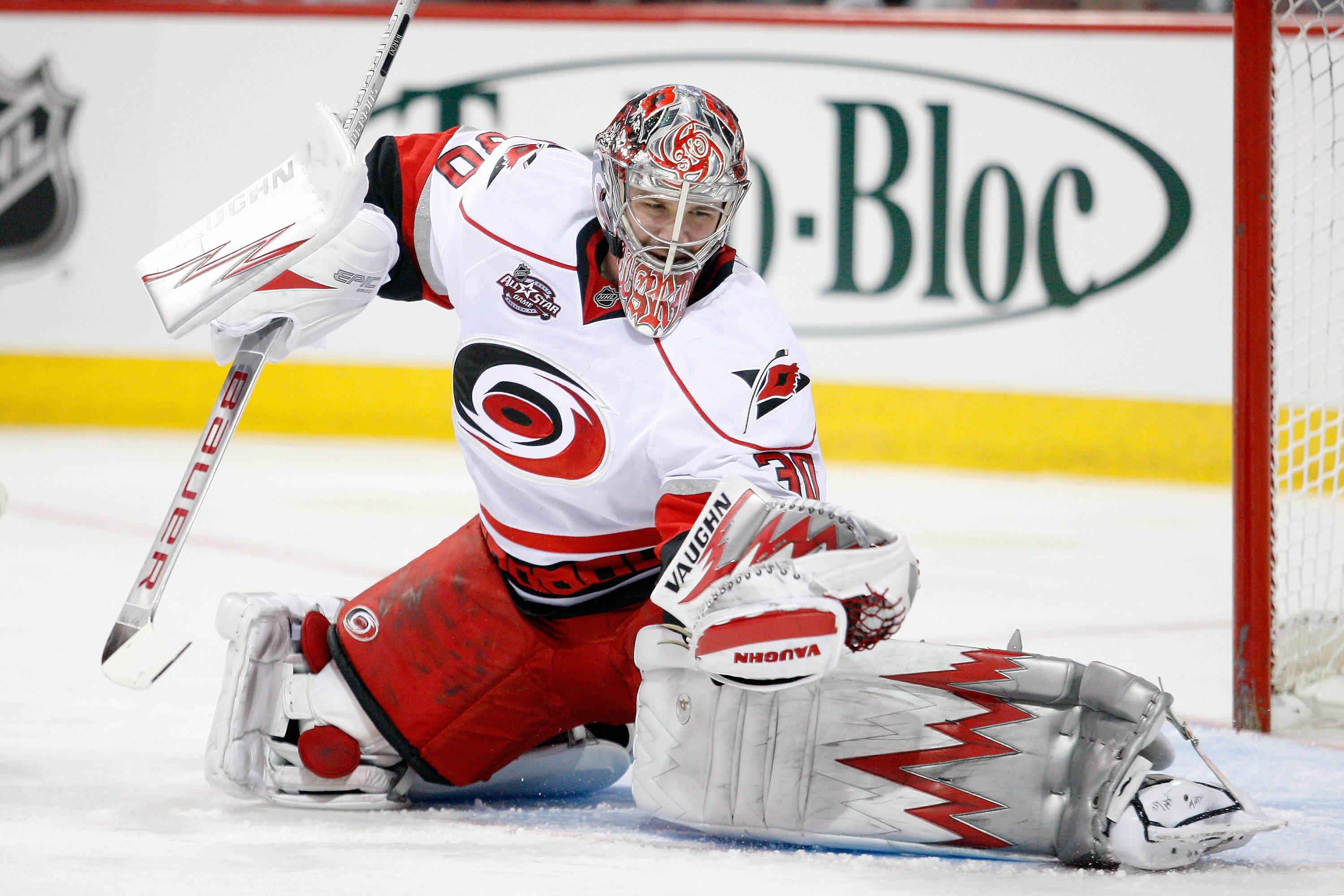 MONTREAL- NOVEMBER 13:  Cam Ward #30 of the Carolina Hurricanes makes a glove save on the puck during the NHL game against the Montreal Canadiens at the Bell Centre on November 13, 2010 in Montreal, Quebec, Canada.  (Photo by Richard Wolowicz/Getty Images