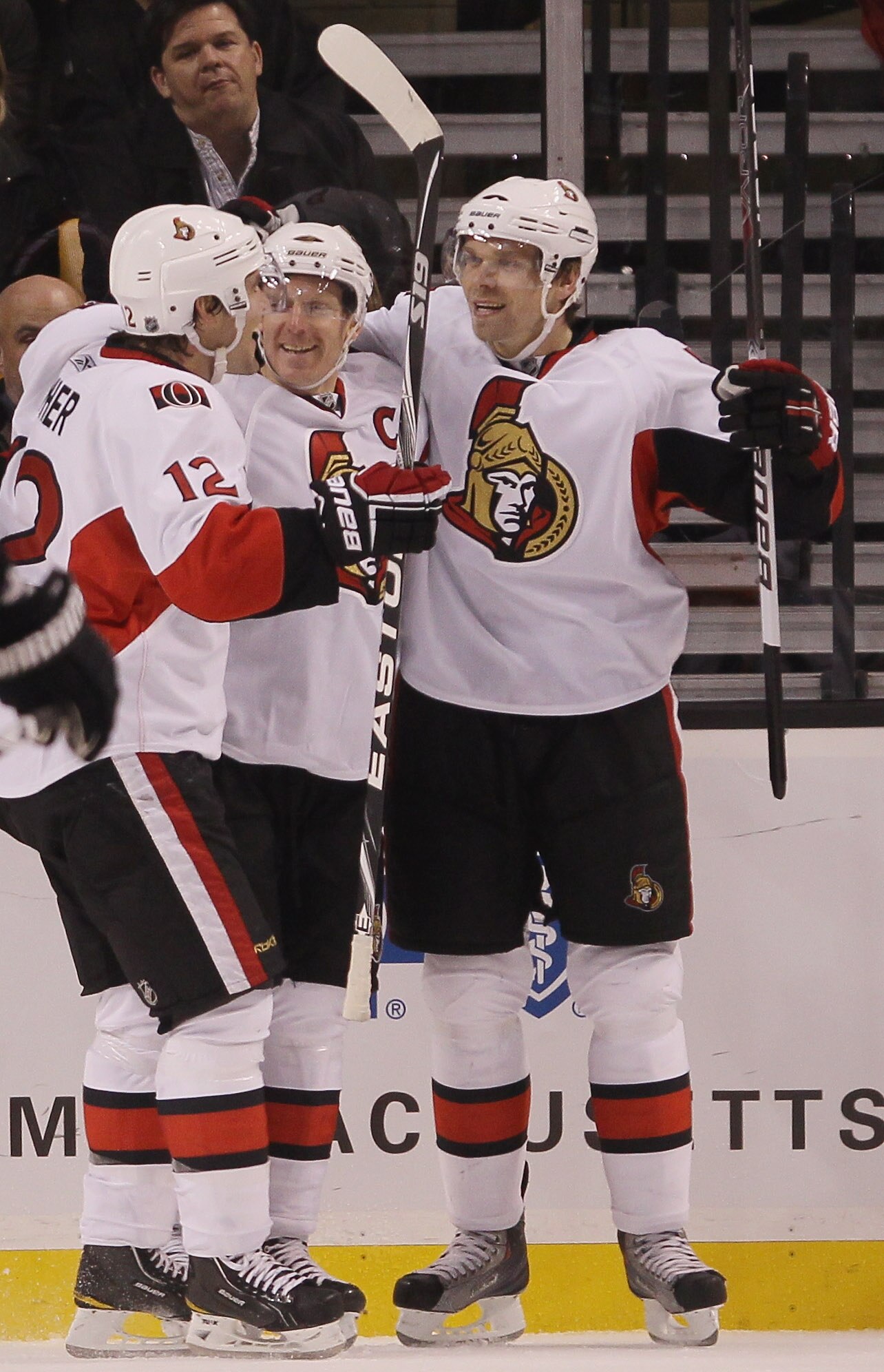 BOSTON - NOVEMBER 13:  Daniel Alfredsson #11 of the Ottawa Senator is congratulated by teammates Mike Fisher #12 and Milan Michalek #9 after Alfredsson scored in the third period against the Boston Bruins on November 13, 2010 at the TD Garden in Boston, M