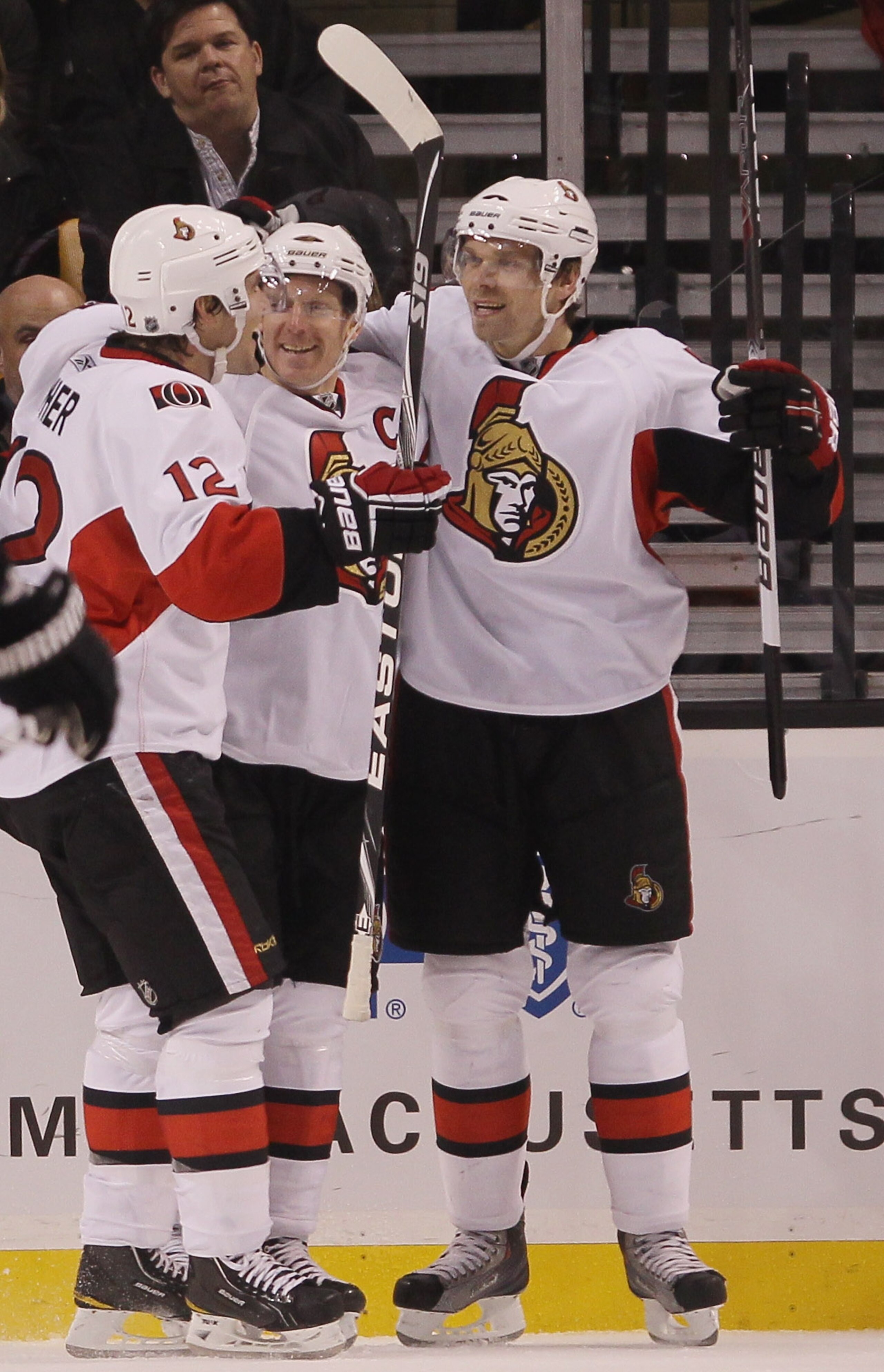 BOSTON - NOVEMBER 13:  Daniel Alfredsson #11 of the Ottawa Senator is congratulated by teammates Mike Fisher #12 and Milan Michalek #9 after Alfredsson scored in the third period against the Boston Bruins on November 13, 2010 at the TD Garden in Boston, M