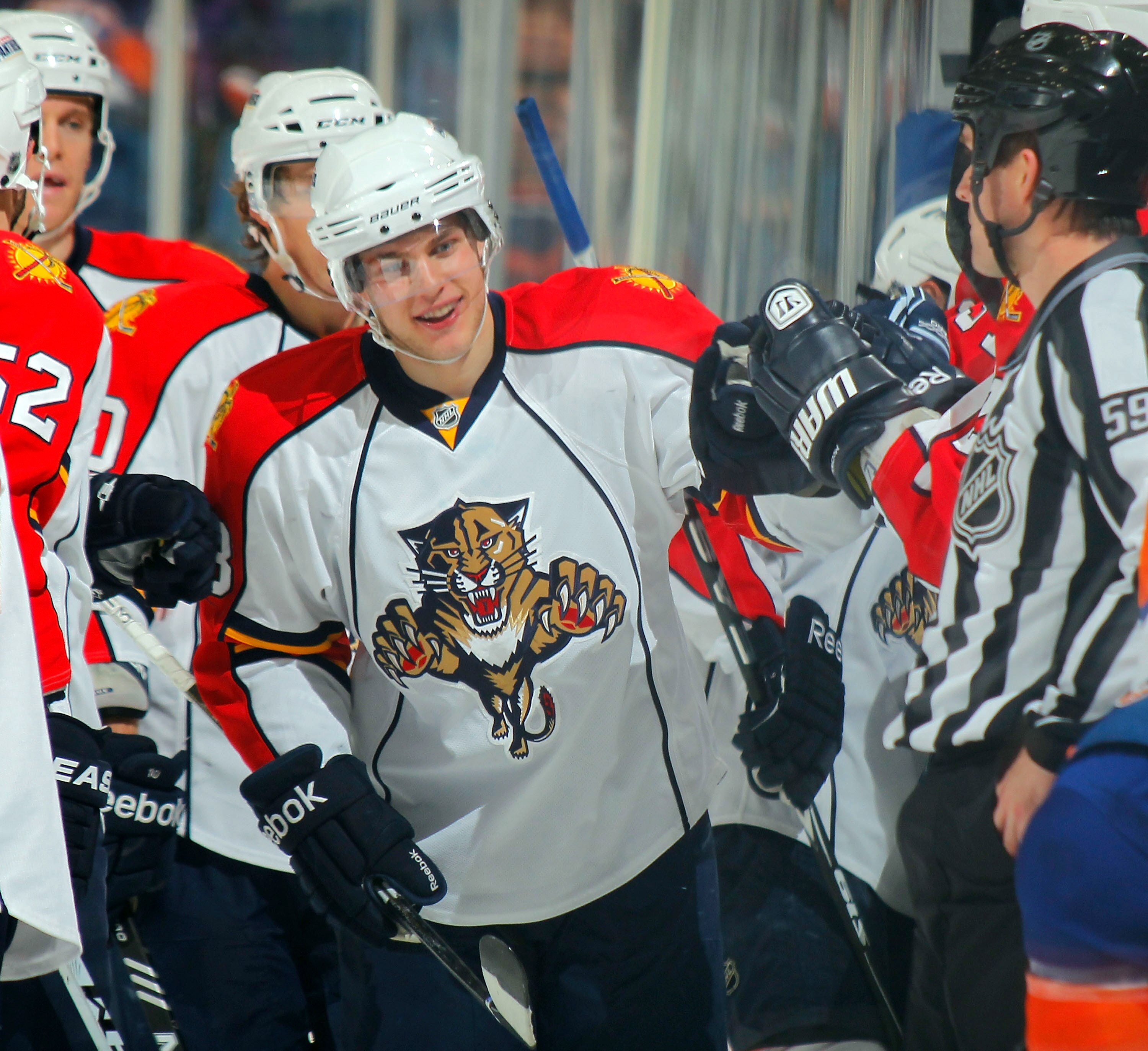 UNIONDALE, NY - NOVEMBER 20:  Mike Santorelli #13 of the Florida Panthers skates to his bench celebrating his goal against the New York Islanders during the second period of a hockey game at the Nassau Coliseum on November 20, 2010 in Uniondale, New York.