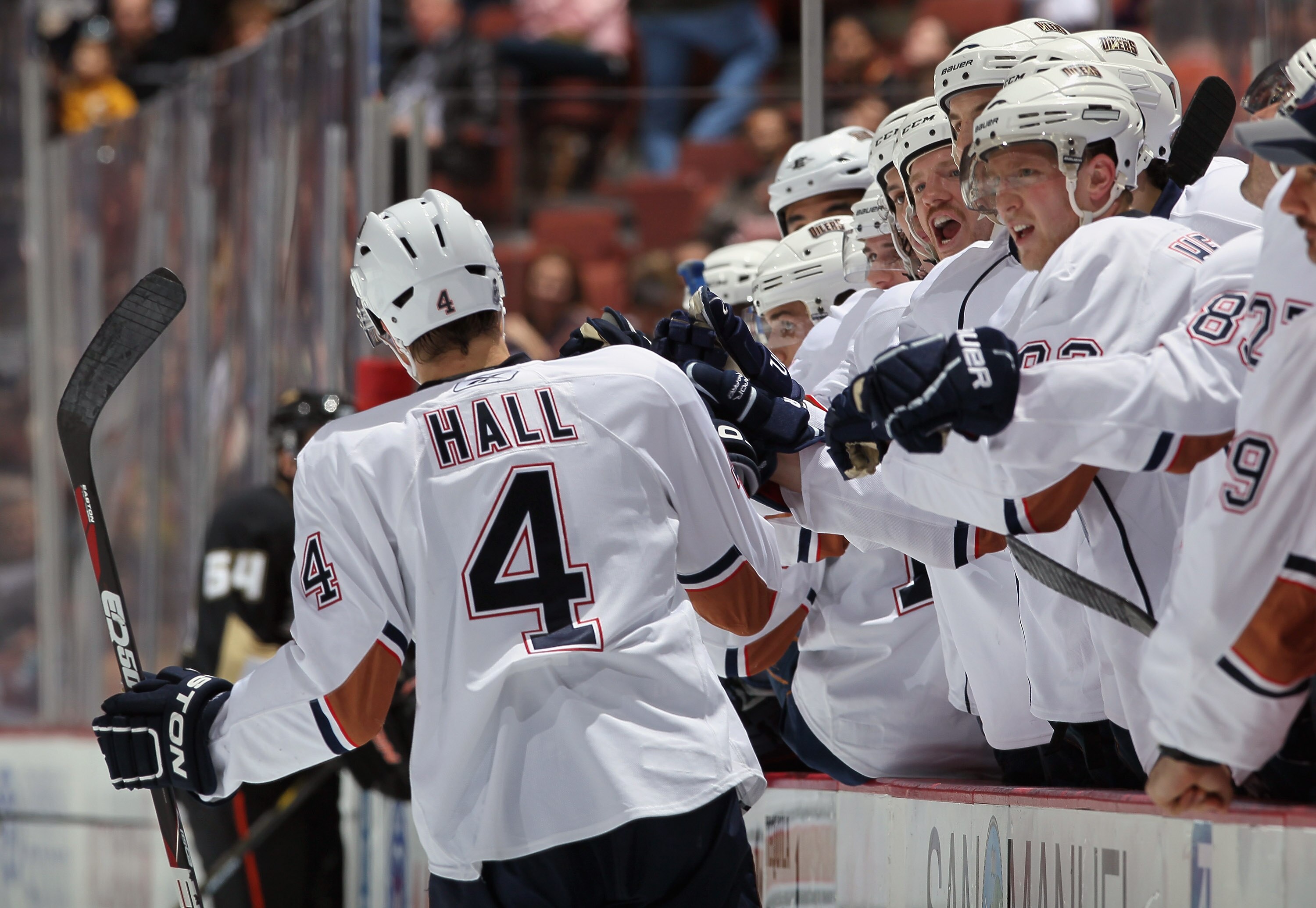 ANAHEIM, CA - NOVEMBER 21:  Taylor Hall #4 of the Edmonton Oilers receives high fives from the bench after scoring a goal against the Anaheim Ducks in the second period at the Honda Center on November 21, 2010 in Anaheim, California.  (Photo by Jeff Gross