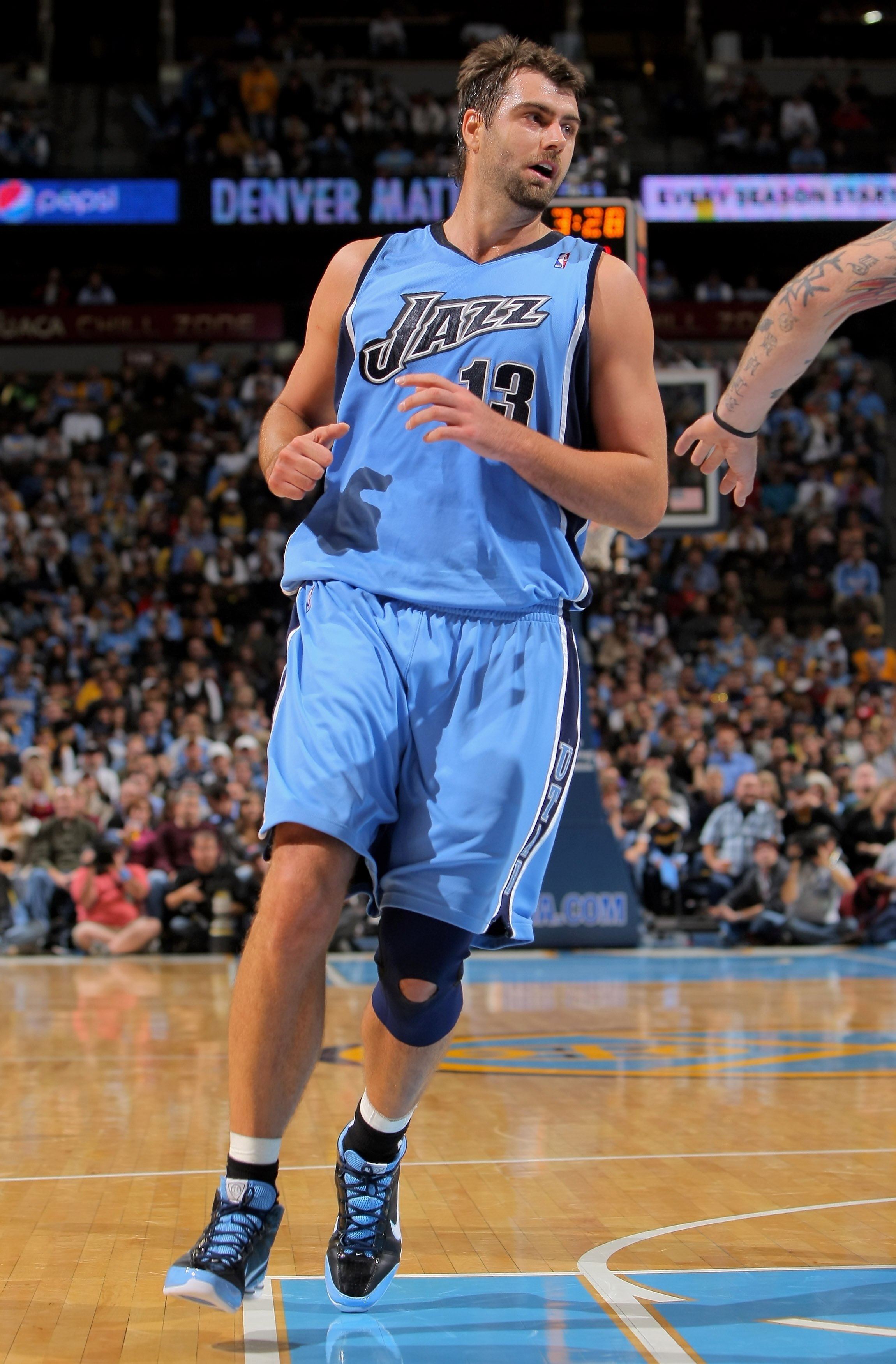 DENVER - OCTOBER 28:  Mehmet Okur #13 of the Utah Jazz heads down court against the Denver Nuggets during NBA action at Pepsi Center on October 28, 2009 in Denver, Colorado. The Nuggets defeated the Jazz 114-105.  (Photo by Doug Pensinger/Getty Images)