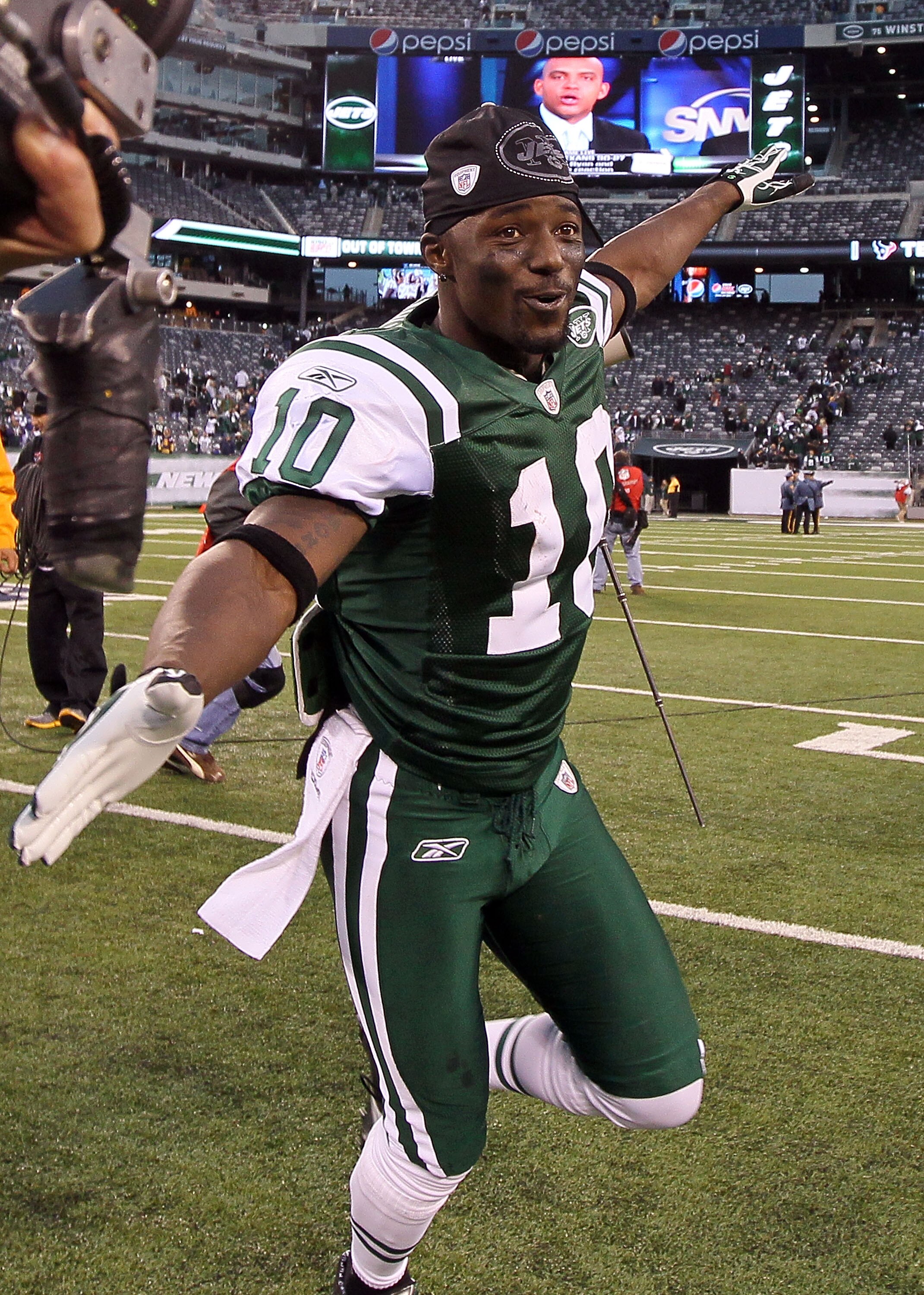 EAST RUTHERFORD, NJ - NOVEMBER 21:  Santonio Holmes #10 of the New York Jets celebrates after defeating the Houston Texans on November 21, 2010 at the New Meadowlands Stadium in East Rutherford, New Jersey. The Jets defeated the Texans 30-27.  (Photo by J