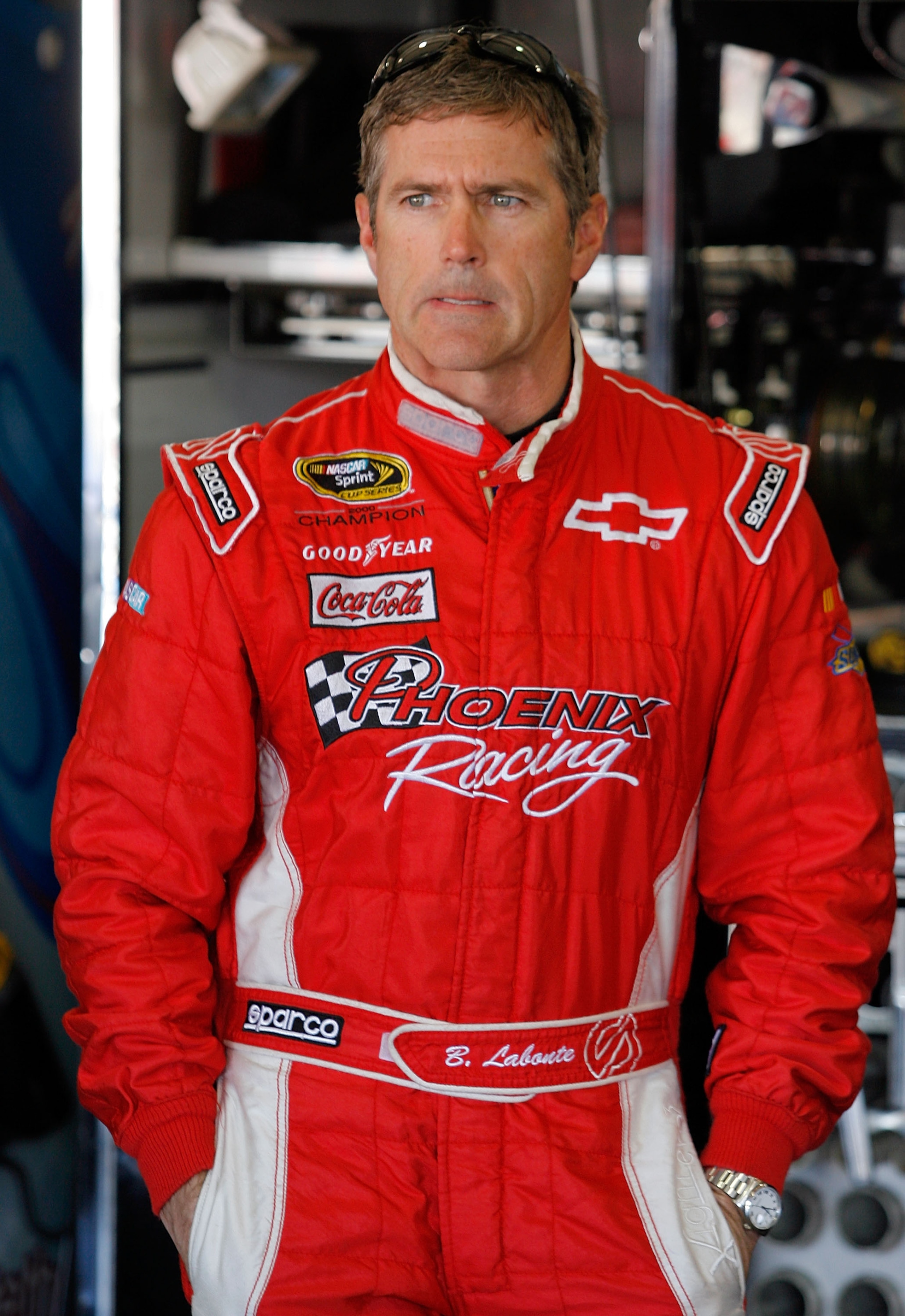 FONTANA, CA - OCTOBER 08:  Bobby Labonte, driver of the #09 Phoenix Construction Chevrolet, stands in the garage during practice for the NASCAR Sprint Cup Series Pepsi Max 400 on October 8, 2010 in Fontana, California.  (Photo by Tom Pennington/Getty Imag