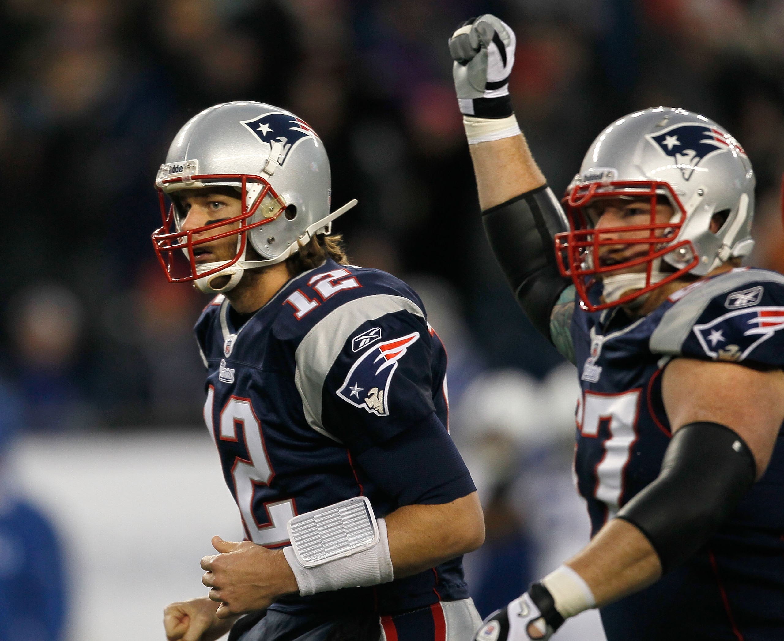 FOXBORO, MA - NOVEMBER 21: Tom Brady #12 of the New England Patriots reacts with teammate Dan Koppen #67 of the New England Patriots after a touchdown in the first half at Gillette Stadium on November 21, 2010 in Foxboro, Massachusetts. (Photo by Jim Roga FOXBORO, MA - NOVEMBER 21: Tom Brady #12 of the New England Patriots reacts with teammate Dan Koppen #67 of the New England Patriots after a touchdown in the first half at Gillette Stadium on November 21, 2010 in Foxboro, Massachusetts. (Photo by Jim Roga