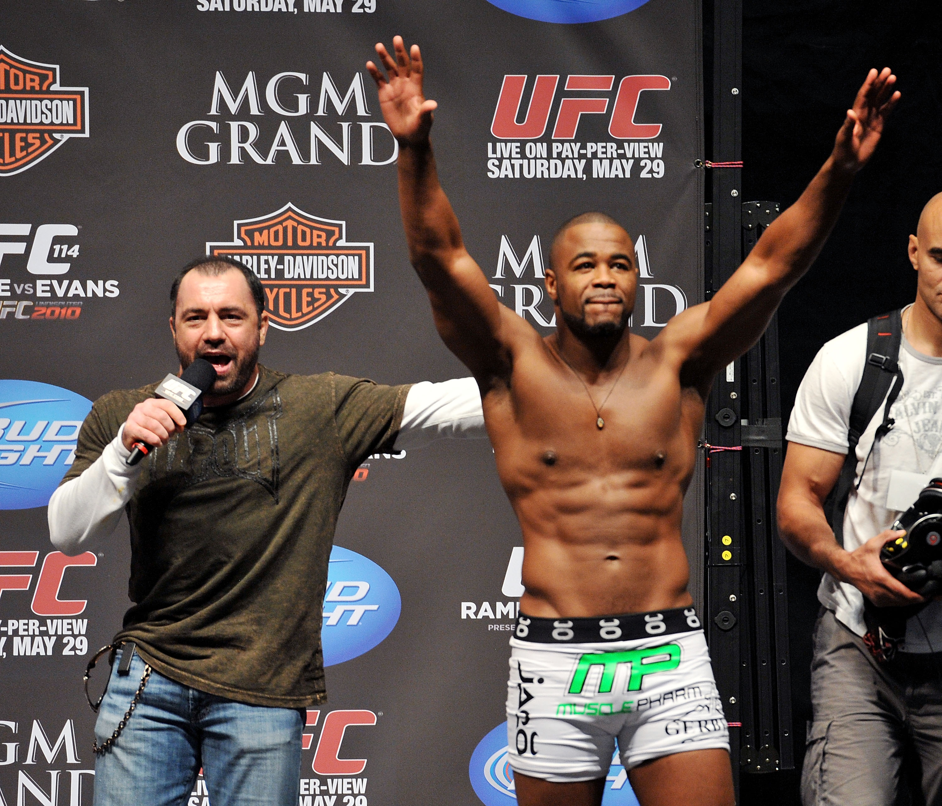 LAS VEGAS - MAY 28:  UFC fighter Rashad Evans (R) reacts to the crowd while speaking to UFC announcer Joe Rogan (L) about his fight against UFC fighter Quinton 'Rampage' Jackson at UFC 114: Rampage versus Rashad at the Mandalay Bay Hotel on May 28, 2010 i