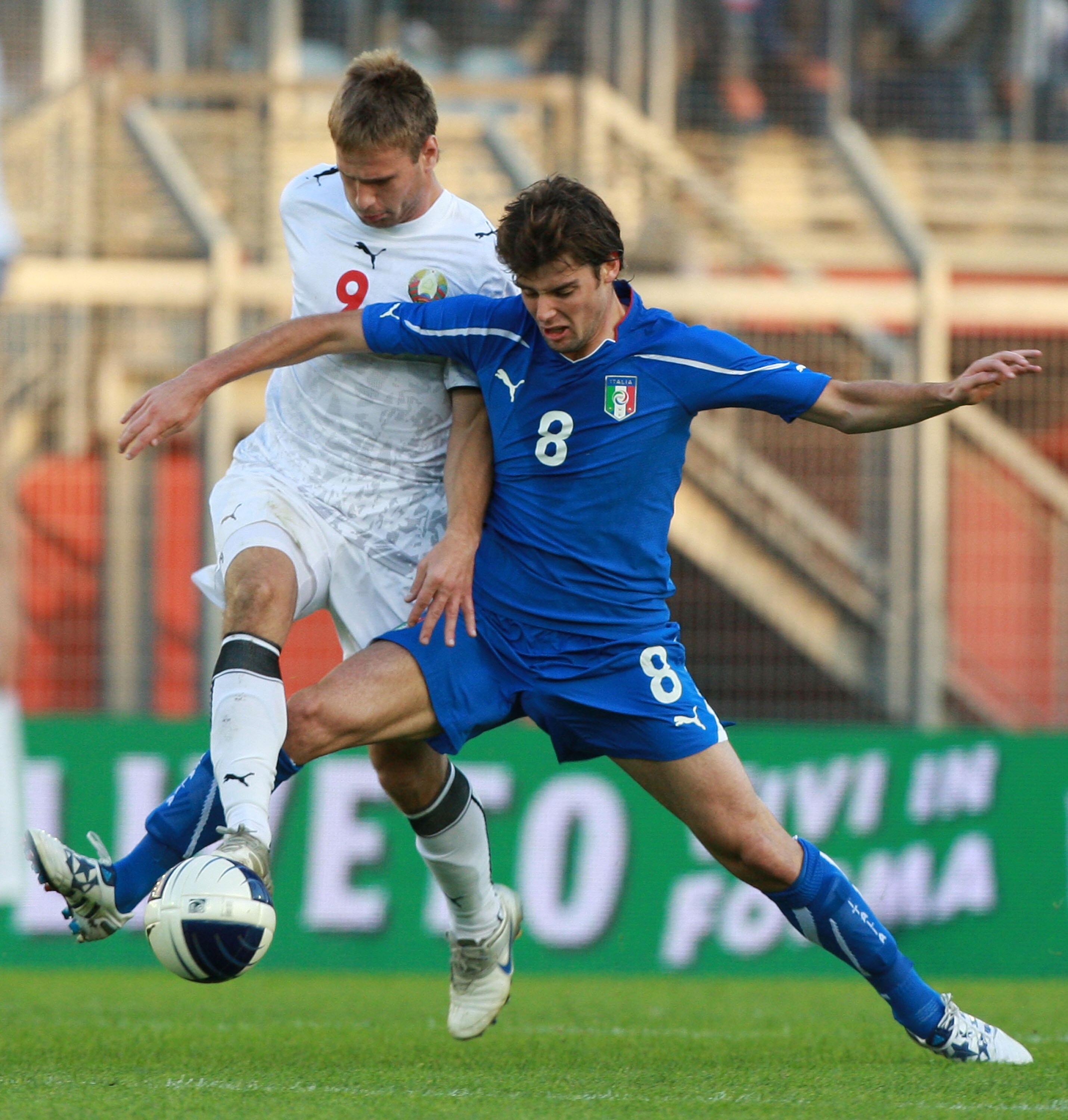 RIETI, ITALY - OCTOBER 08:  Andrea Poli (R) of Italy competes for the ball with  Maksim Skavish of Belarus during the Uefa U21 Championship play-off match between Italy and Belarus at Stadio Centro d'Italia - Manlio Scopigno on October 8, 2010 in Rieti, I