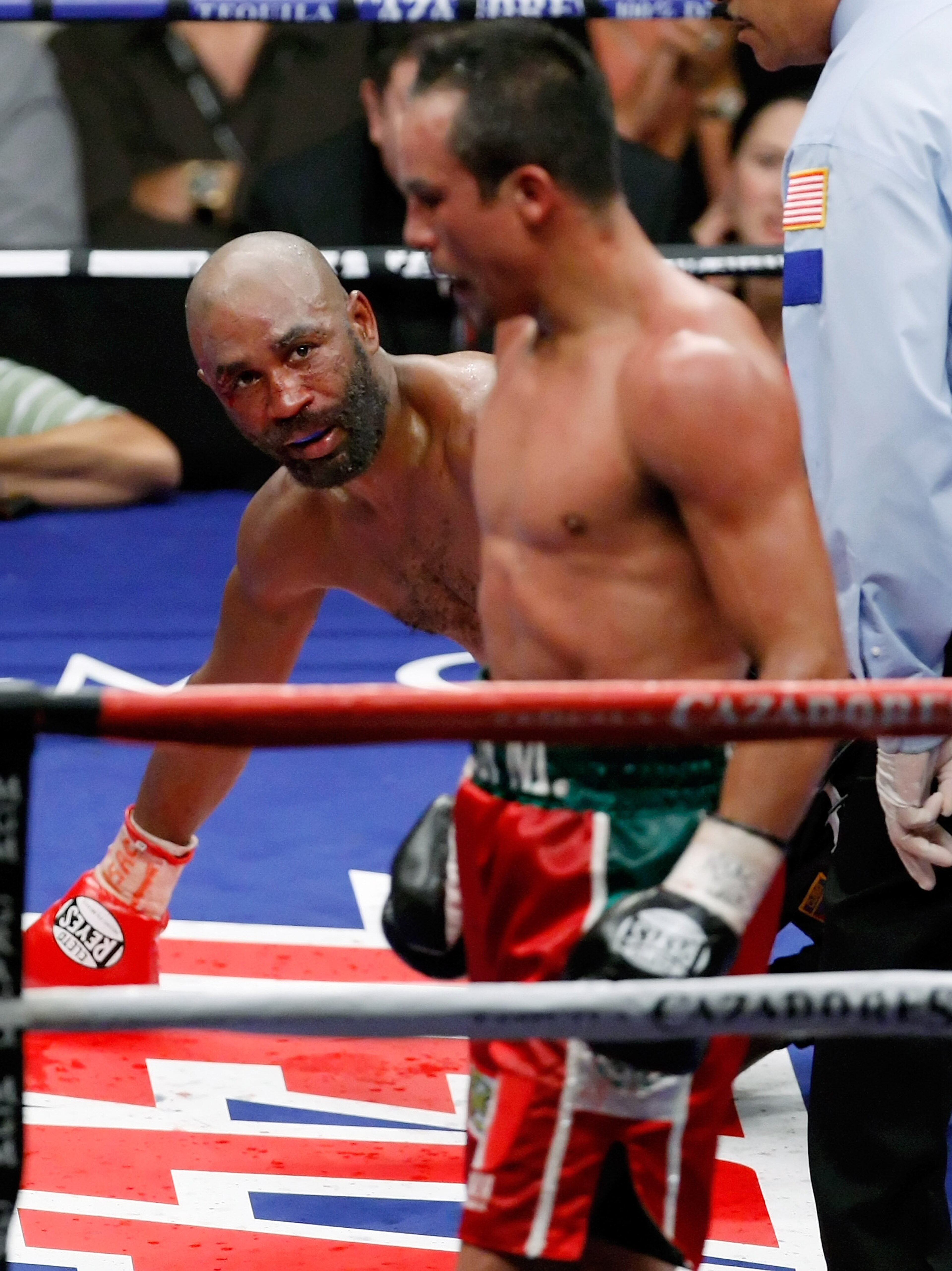 LAS VEGAS - SEPTEMBER 13:  Joel Casamayor (L) looks back at Juan Manuel Marquez after being knocked down in the 11th round of their bout at the MGM Grand Garden Arena September 13, 2008 in Las Vegas, Nevada. Marquez won by knockout in the 11th round.  (Ph