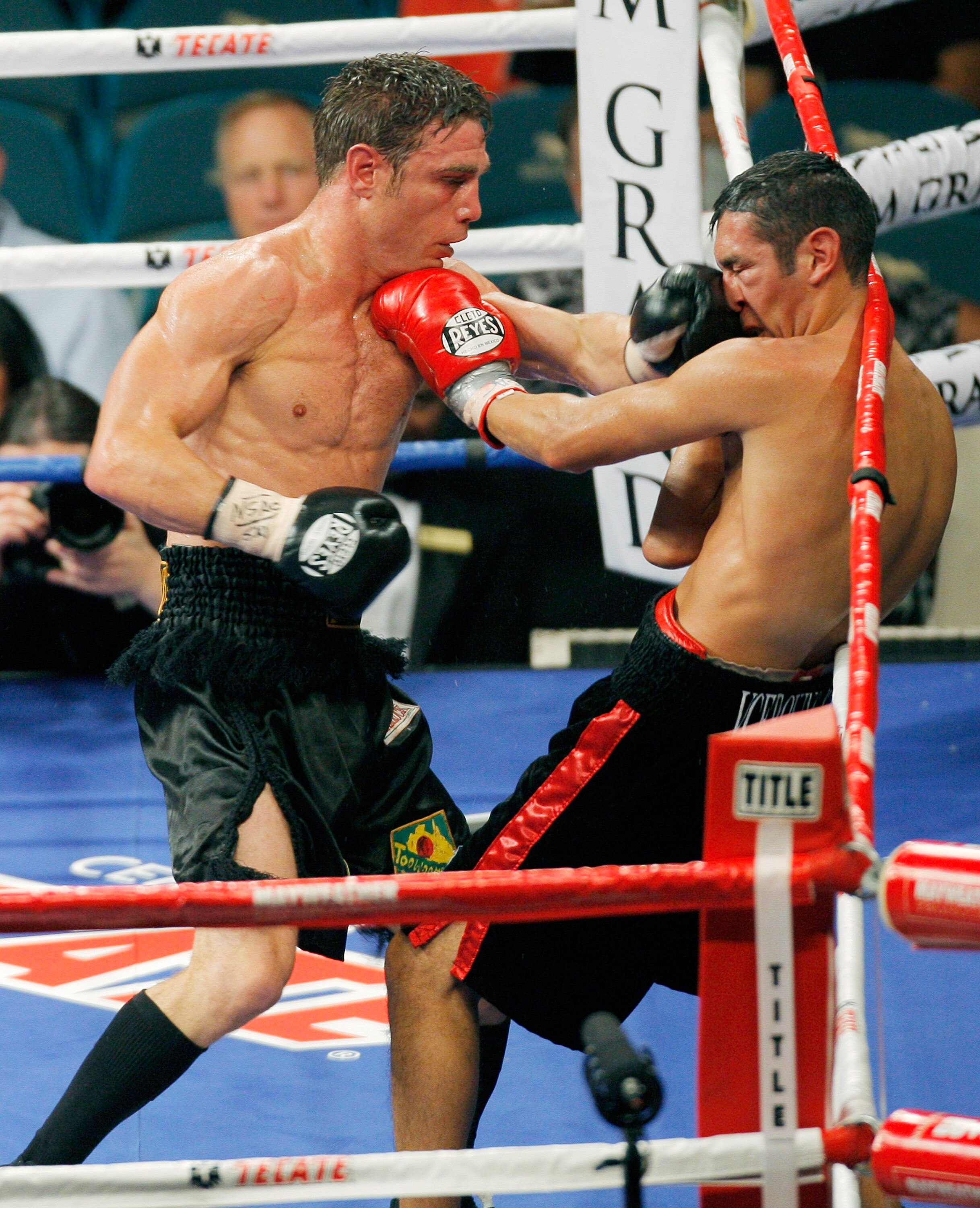 LAS VEGAS - SEPTEMBER 19:  Michael Katsidis (R) trades punches with Vincent Escobedo during their WBO interim lightweight title fight at the MGM Grand Garden Arena September 19, 2009 in Las Vegas, Nevada. Katsidis won by split decision.  (Photo by Eric Ja
