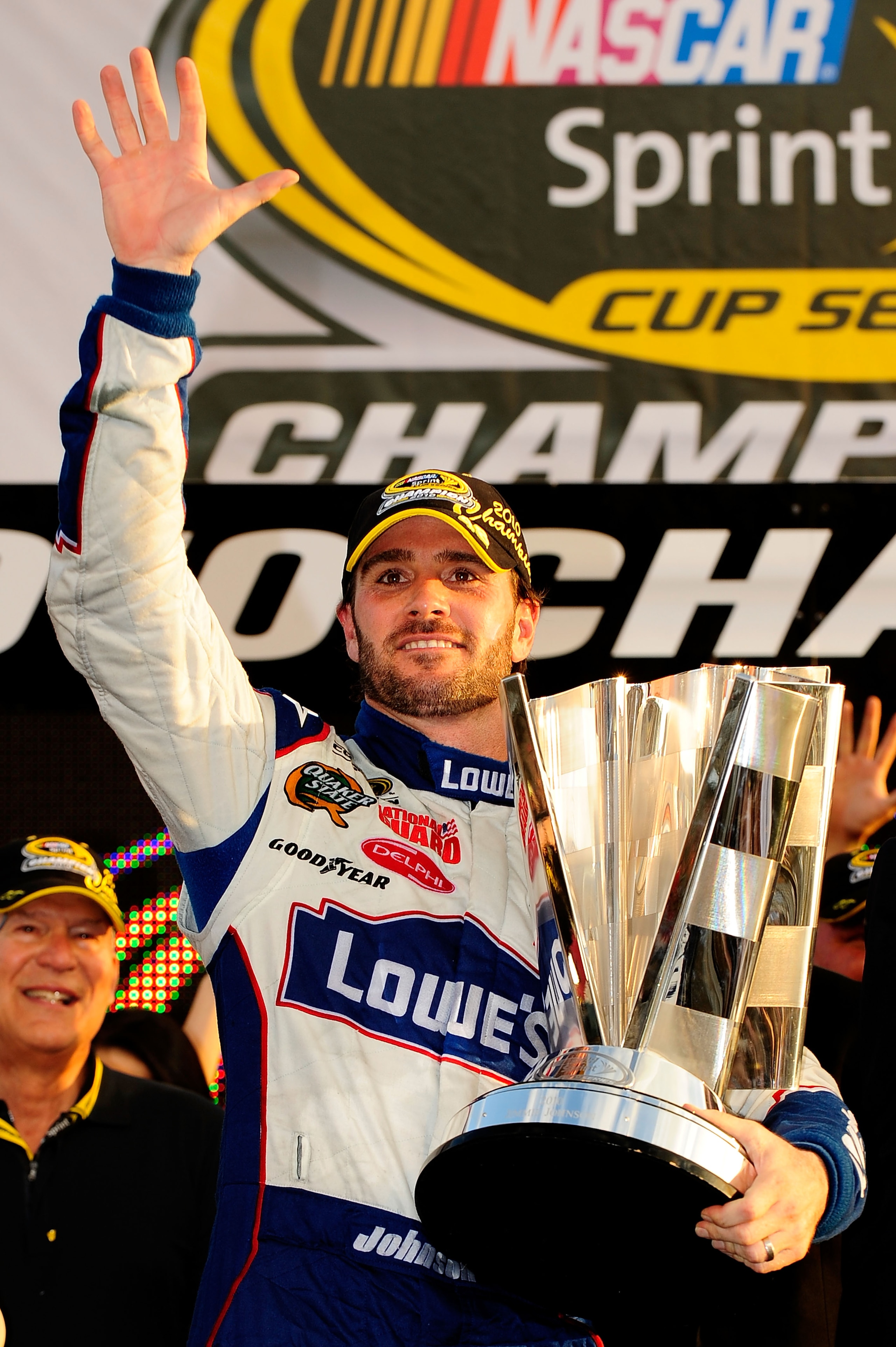 HOMESTEAD, FL - NOVEMBER 21:  Jimmie Johnson, driver of the #48 Lowe's Chevrolet, celebrates after finishing in second place in the Ford 400 to clinch his fifth consecutive NASCAR Sprint Cup championship at Homestead-Miami Speedway on November 21, 2010 in