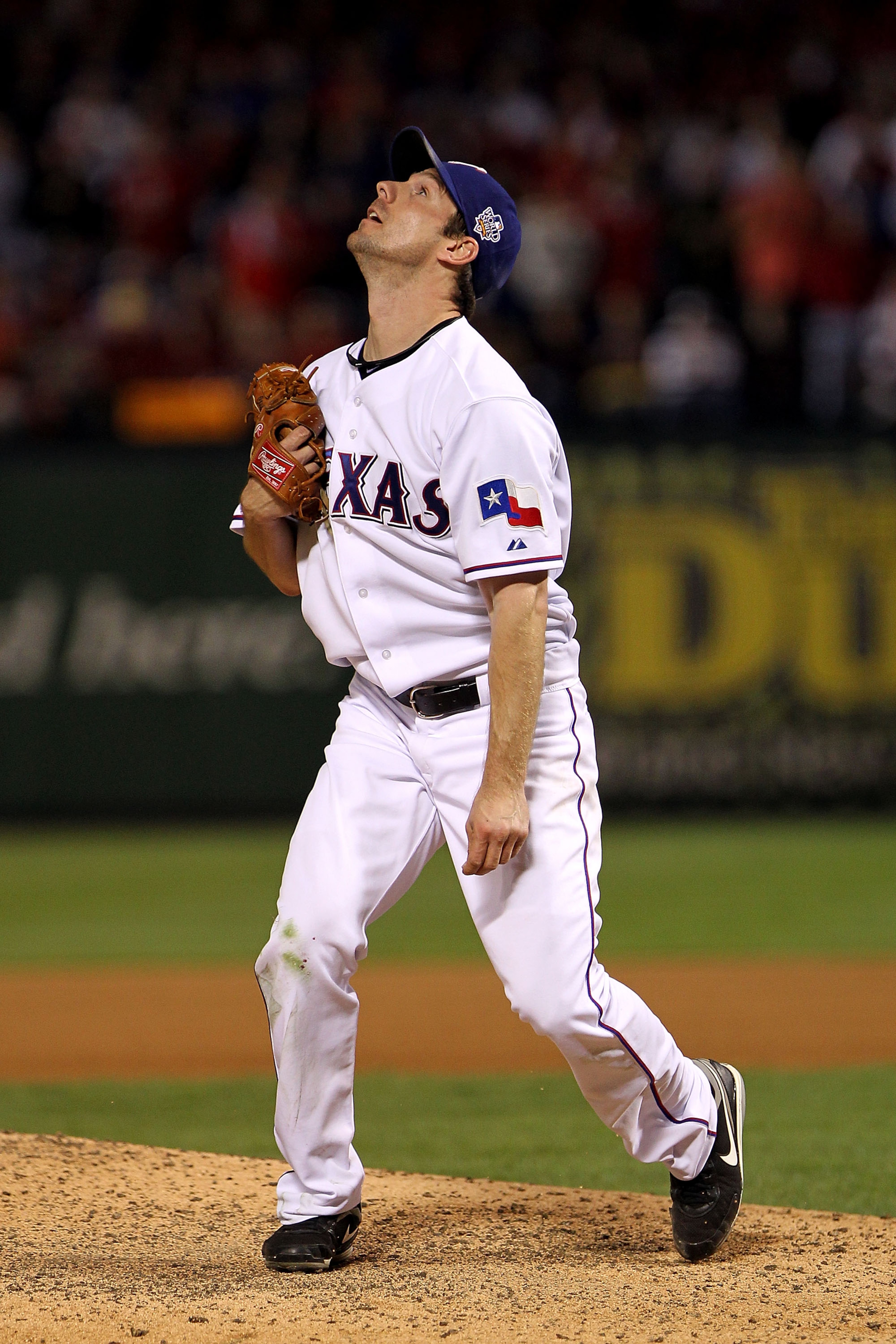 ARLINGTON, TX - NOVEMBER 01: Cliff Lee #33 of the Texas Rangers watches a 3-run home run hit by Edgar Renteria #16 of the San Francisco Giants leave the ballpark in Game Five of the 2010 MLB World Series at Rangers Ballpark in Arlington on November 1, 20 ARLINGTON, TX - NOVEMBER 01: Cliff Lee #33 of the Texas Rangers watches a 3-run home run hit by Edgar Renteria #16 of the San Francisco Giants leave the ballpark in Game Five of the 2010 MLB World Series at Rangers Ballpark in Arlington on November 1, 20