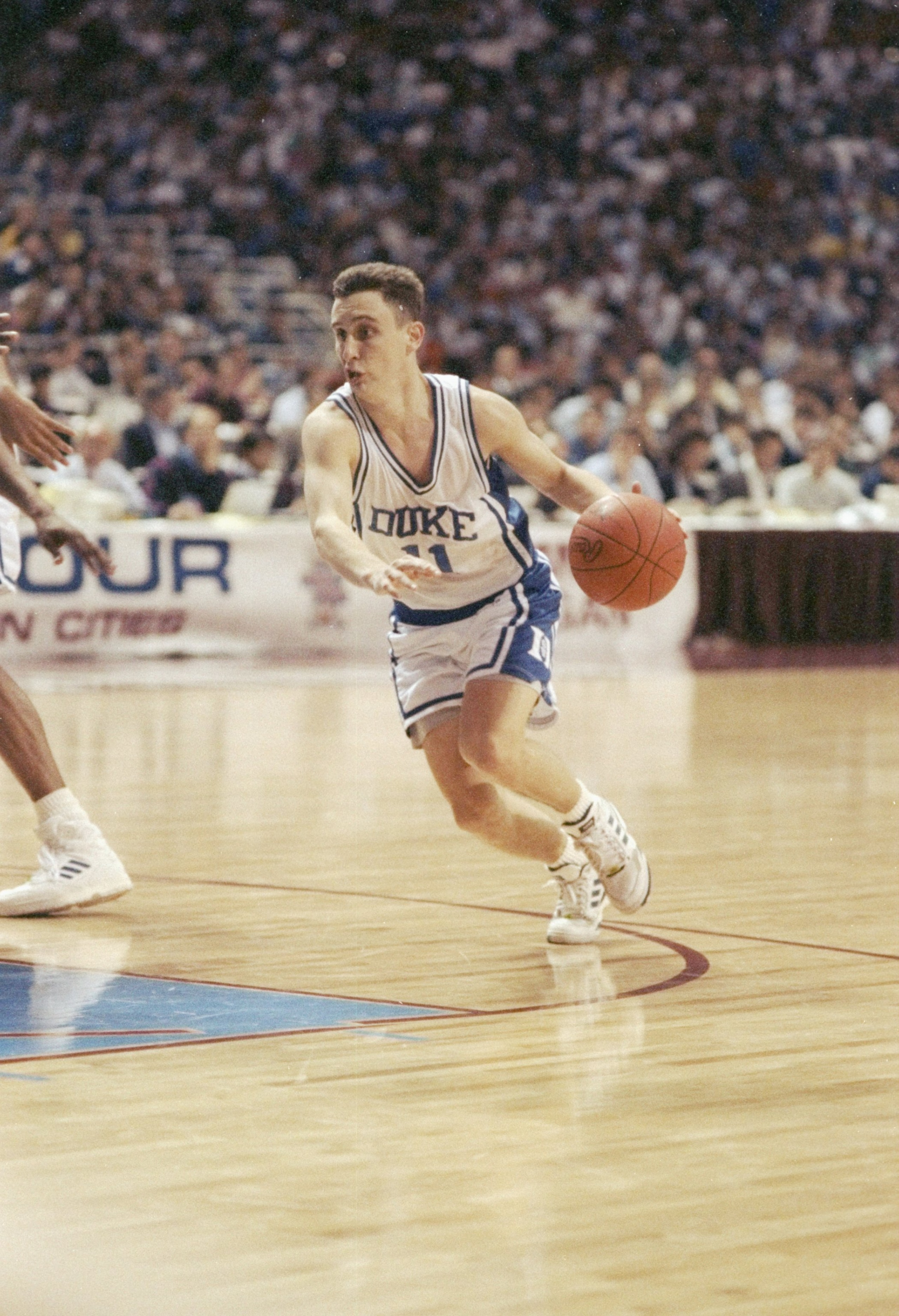 6 Apr 1992:  Guard Bobby Hurley of the Duke Blue Devils dribbles the ball down the court during a playoff game against the Michigan Wolverines at the Hubert H. Humphrey Metrodome in Minneapolis, Minnesota.  Duke won the game 71-51. Mandatory Credit: Jonat
