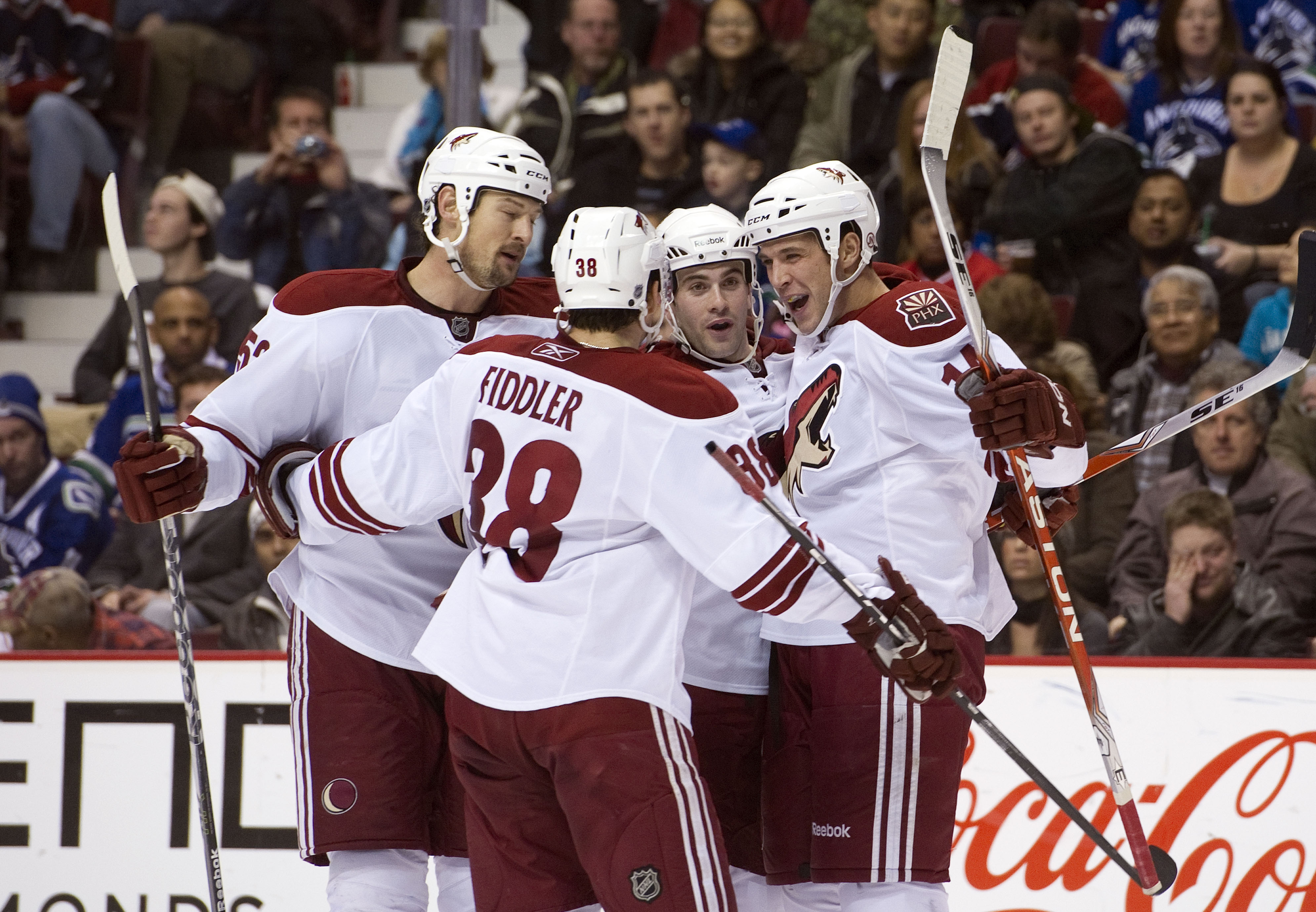 VANCOUVER, CANADA - NOVEMBER 21: Taylor Pyatt #14 of the Phoenix Coyotes celebrates with Keith Yandle #3, Vernon Fiddler #38 and Nolan Yonkman #52 during the third period in NHL action on November 21, 2010 at Rogers Arena in Vancouver, British Columbia, C