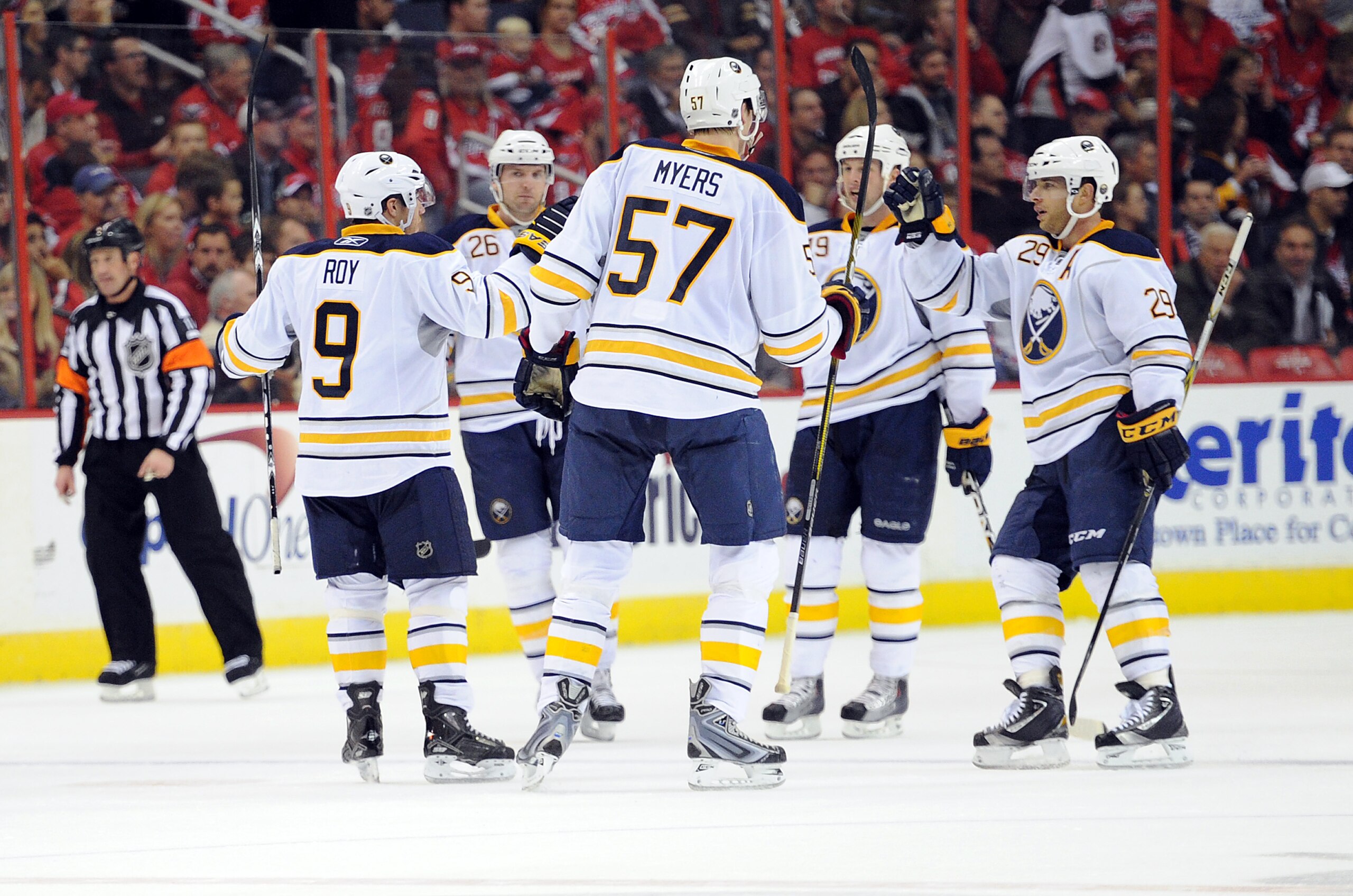 WASHINGTON - NOVEMBER 17:  Derek Roy  #9 of the Buffalo Sabres celebrates with teammates after scoring in the second period against the Washington Capitals at the Verizon Center on November 17, 2010 in Washington DC.  (Photo by Greg Fiume/Getty Images)