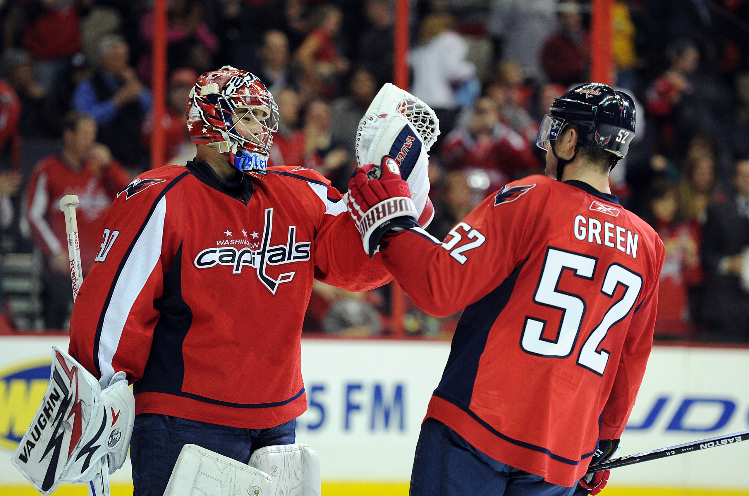 WASHINGTON - NOVEMBER 17:  Michal Neuvirth #30 of the Washington Capitals is congratulated by Mike Green #52 after a 4-2 victory against the Buffalo Sabres at the Verizon Center on November 17, 2010 in Washington DC.  (Photo by Greg Fiume/Getty Images)