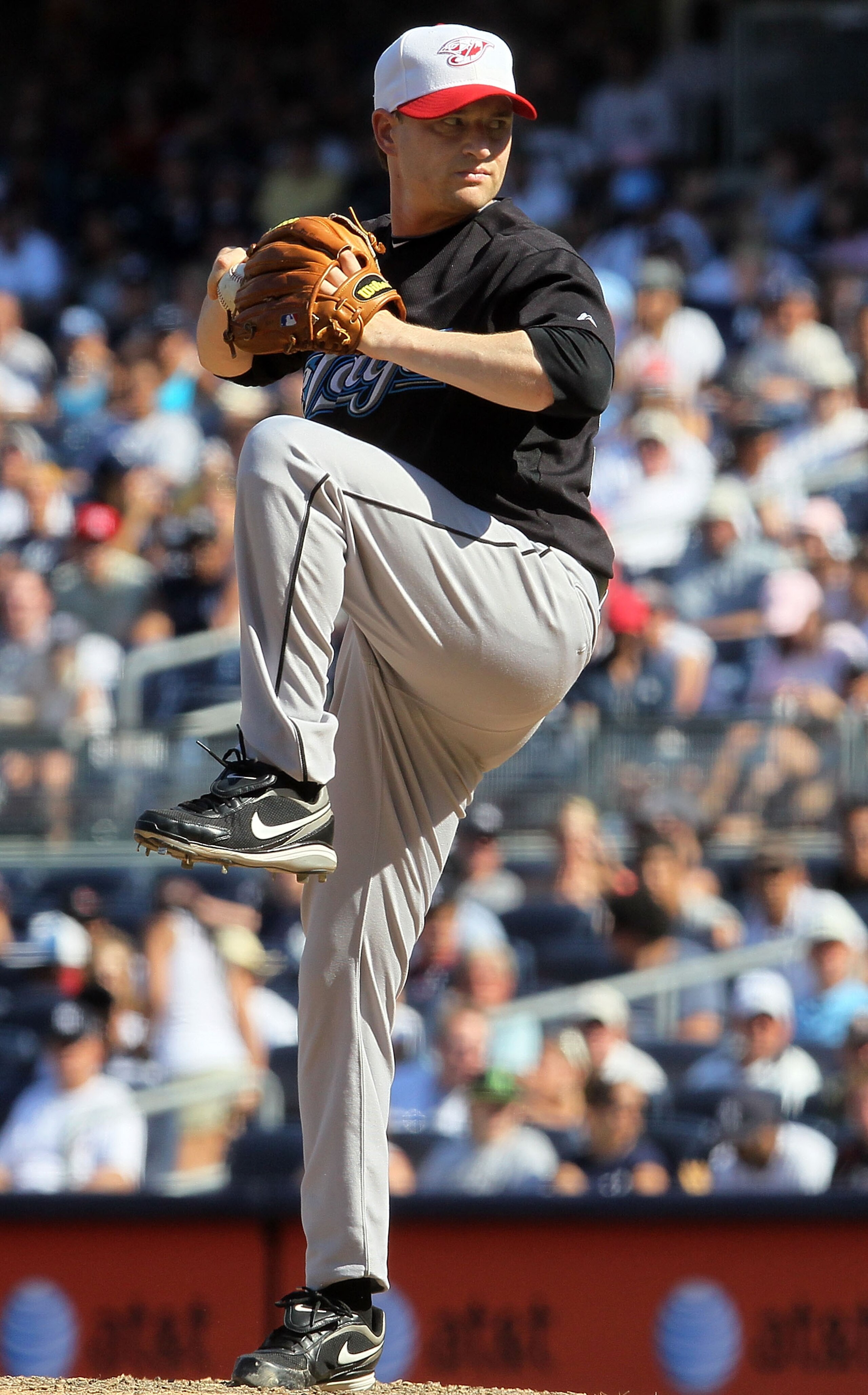 NEW YORK - JULY 04:  Jason Frasor #54 of the Toronto Blue Jays delivers a pitch against the New York Yankees on July 4, 2010 at Yankee Stadium in the Bronx borough of New York City.  (Photo by Jim McIsaac/Getty Images)