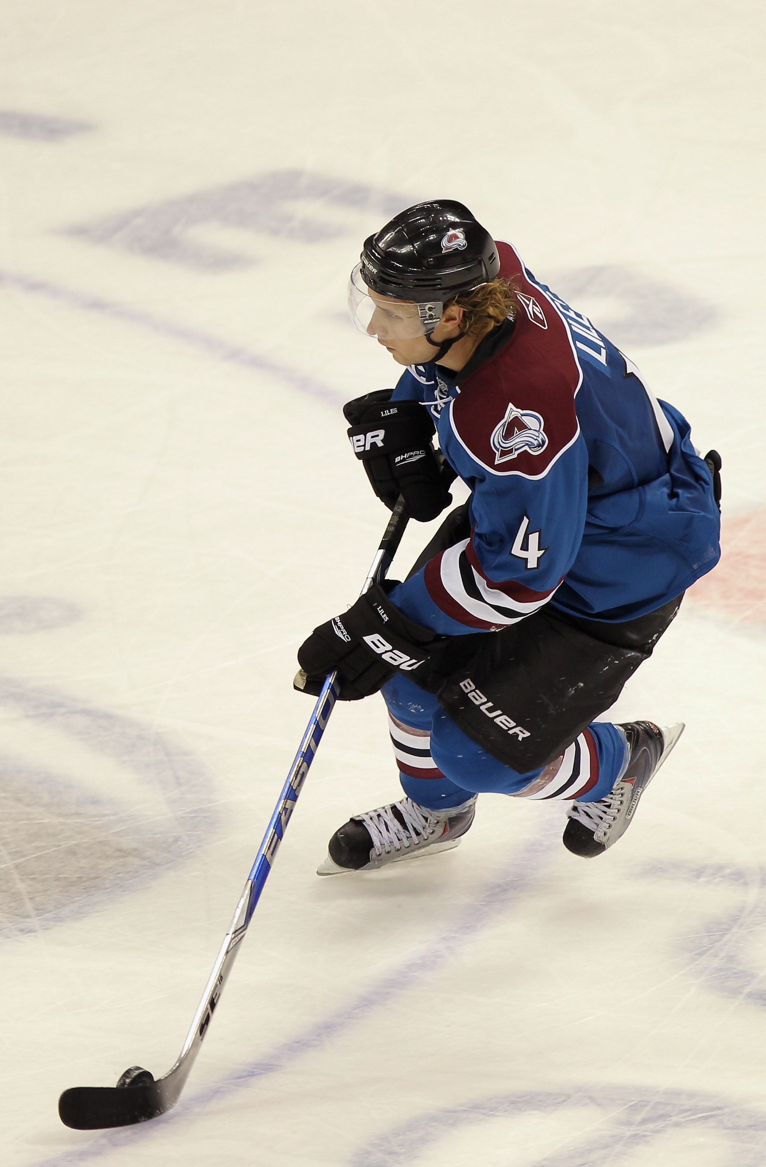DENVER - NOVEMBER 15:  Defenseman John-Michael Liles #4 of the Colorado Avalanche controls the puck against the St. Louis Blues at the Pepsi Center on November 15, 2010 in Denver, Colorado. Liles had two goals as the Avalanche defeated the Blues 6-3.  (Ph