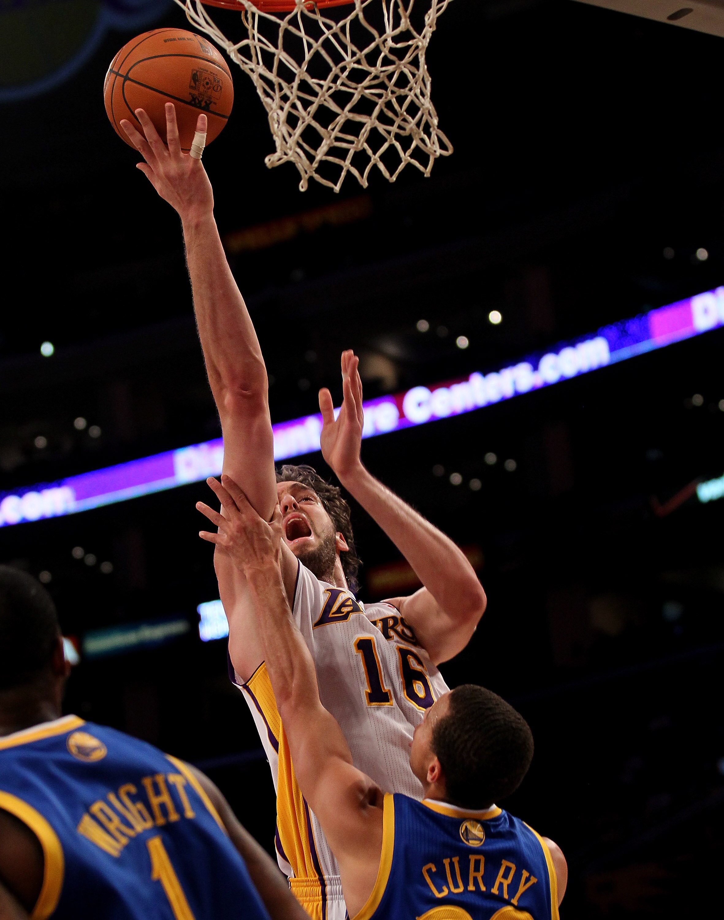LOS ANGELES - NOVEMBER 21:  Pau Gasol #16 of the Los Angeles Lakers shoots over Stephen Curry #30 of the Golden State Warriors at Staples Center on November 21, 2010 in Los Angeles, California. The Lakers won 117-89. NOTE TO USER: User expressly acknowled