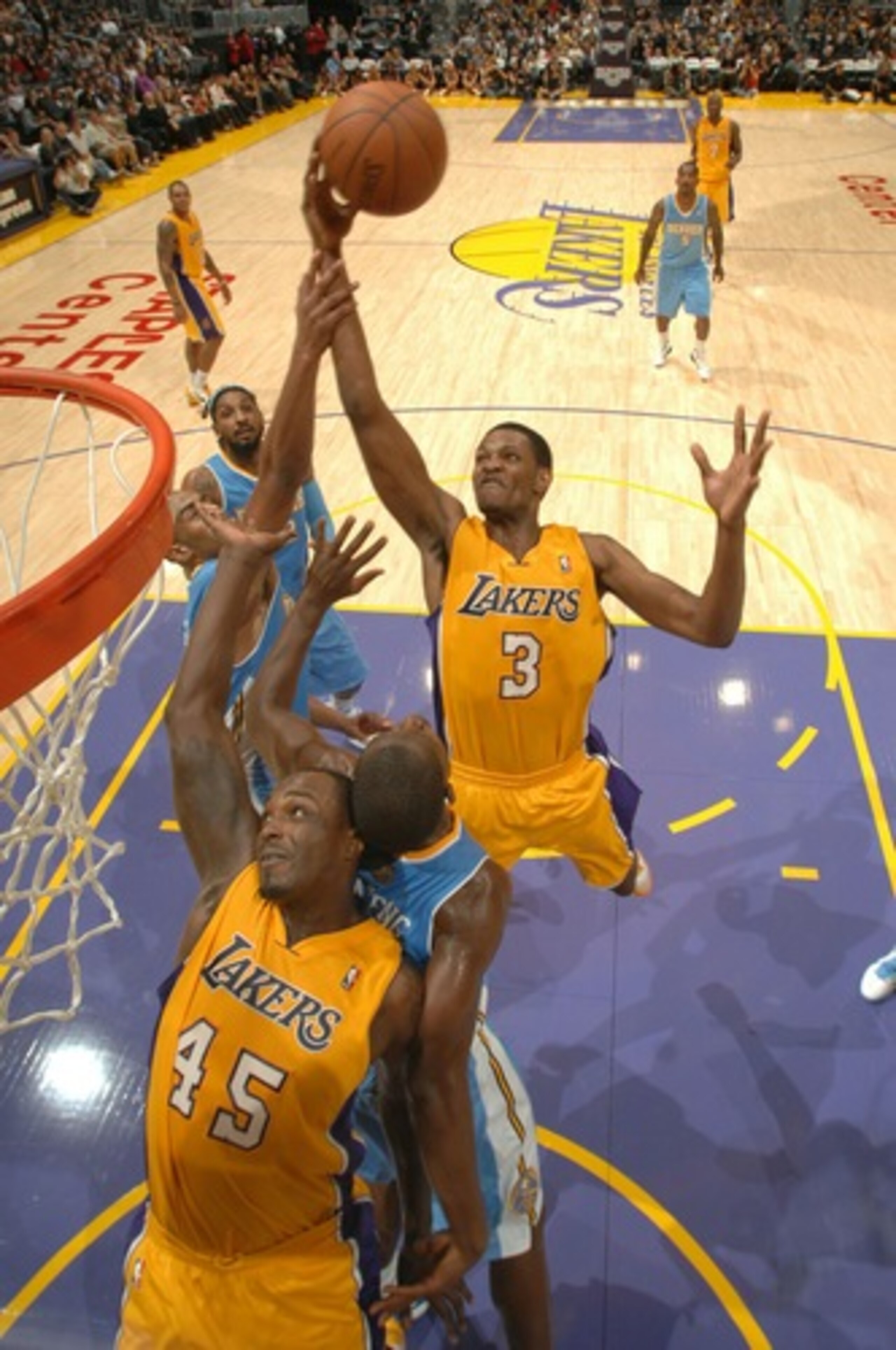 Ebanks (3) soars from rebound even over Caracter (45)