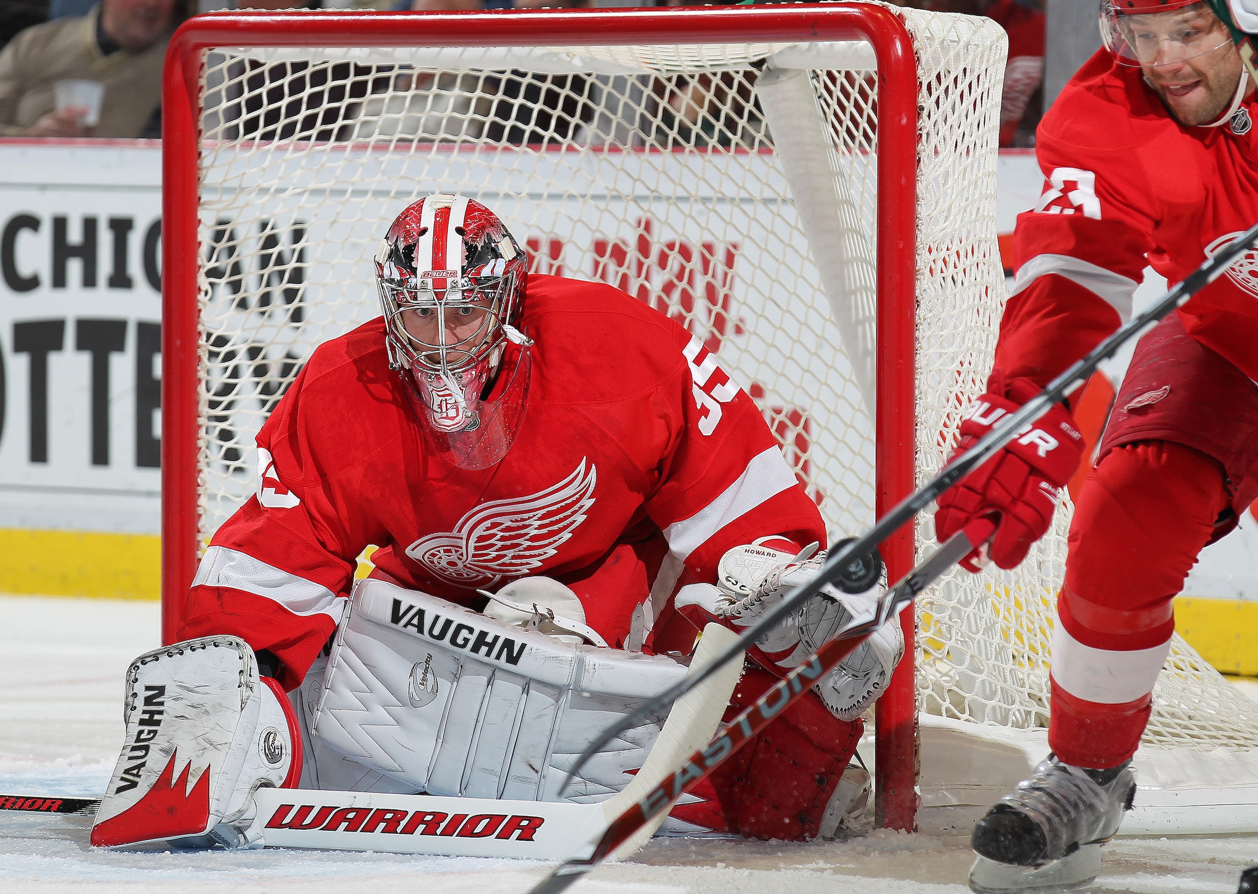 DETROIT, MI - NOVEMBER 19:  Jimmy Howard #35 of the Detroit Red Wings eyes a puck he is about to stop in a game against the Minnesota Wild on November 19, 2010 at the Joe Louis Arena in Detroit, Michigan. (Photo by Claus Andersen/Getty Images)